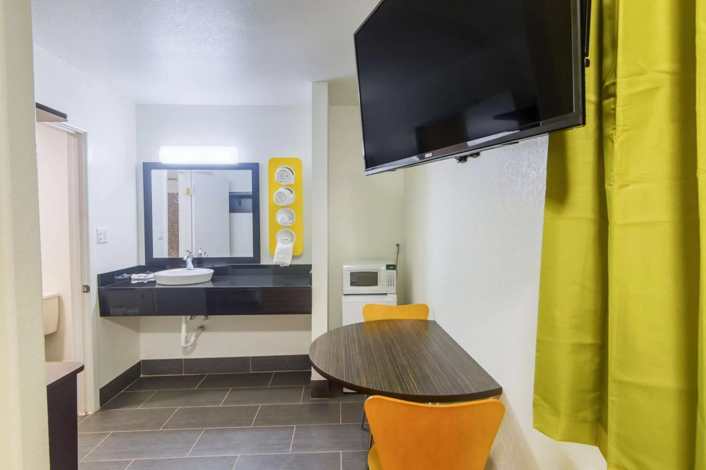 Bathroom, TV/Entertainment Center in Motel 6-Childress, TX