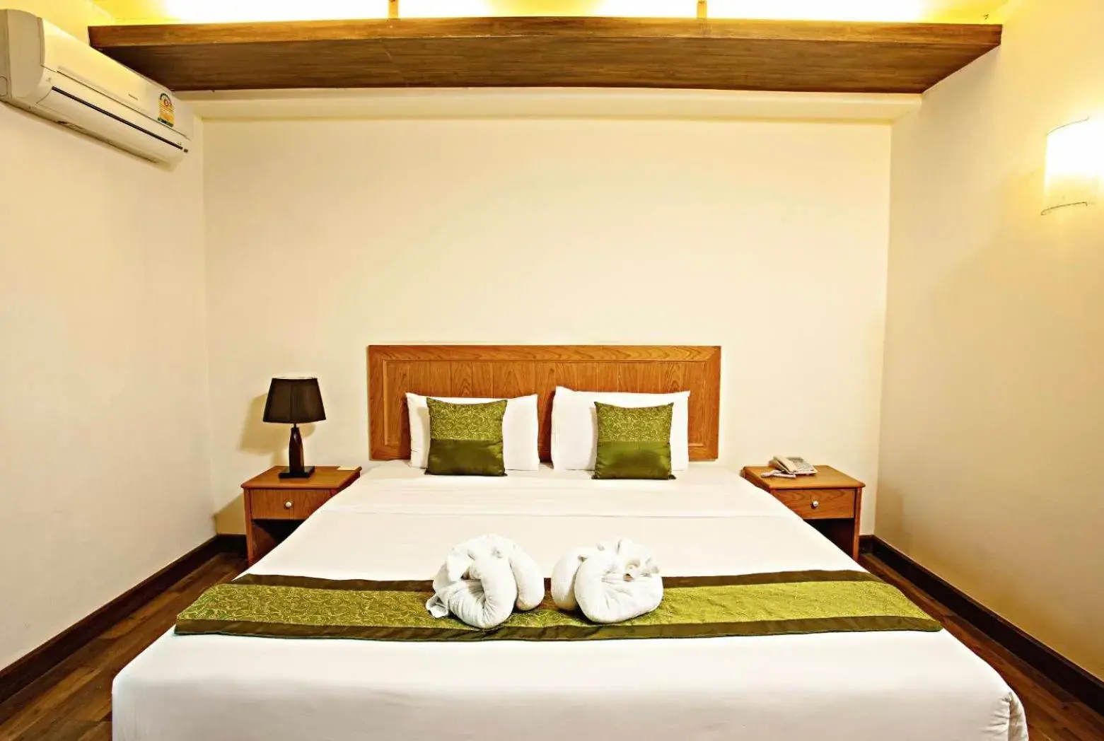 Bed in TM Land Hotel