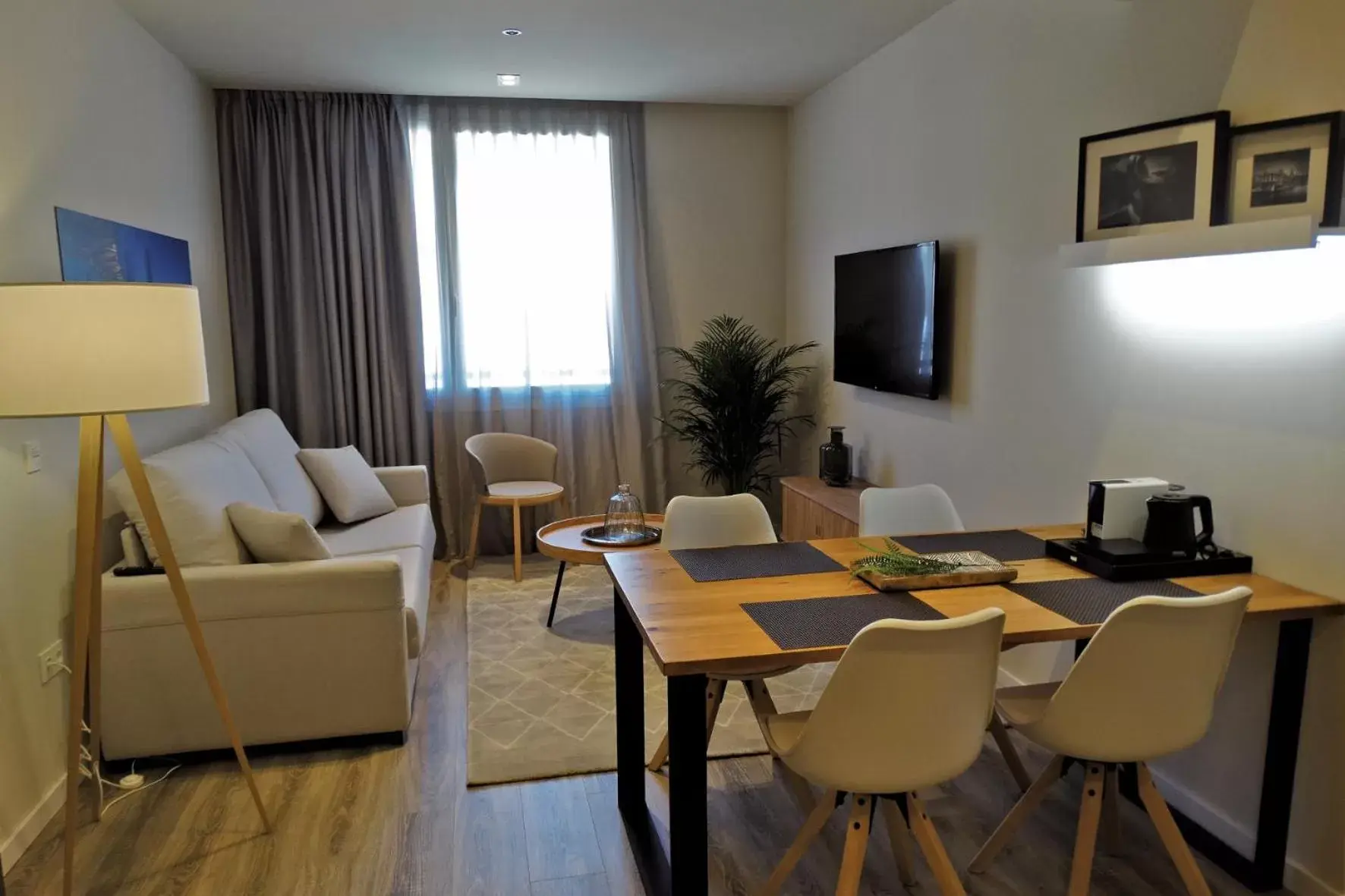 Living room in Bilbao City Center by abba Suites Living room in Bilbao City Center by abba Suites