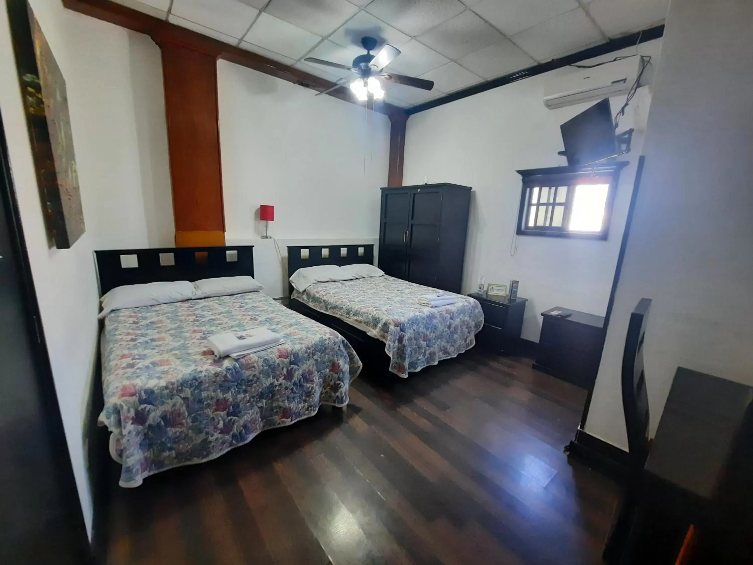 Photo of the whole room, Bed in Garcias Suites y Hotel