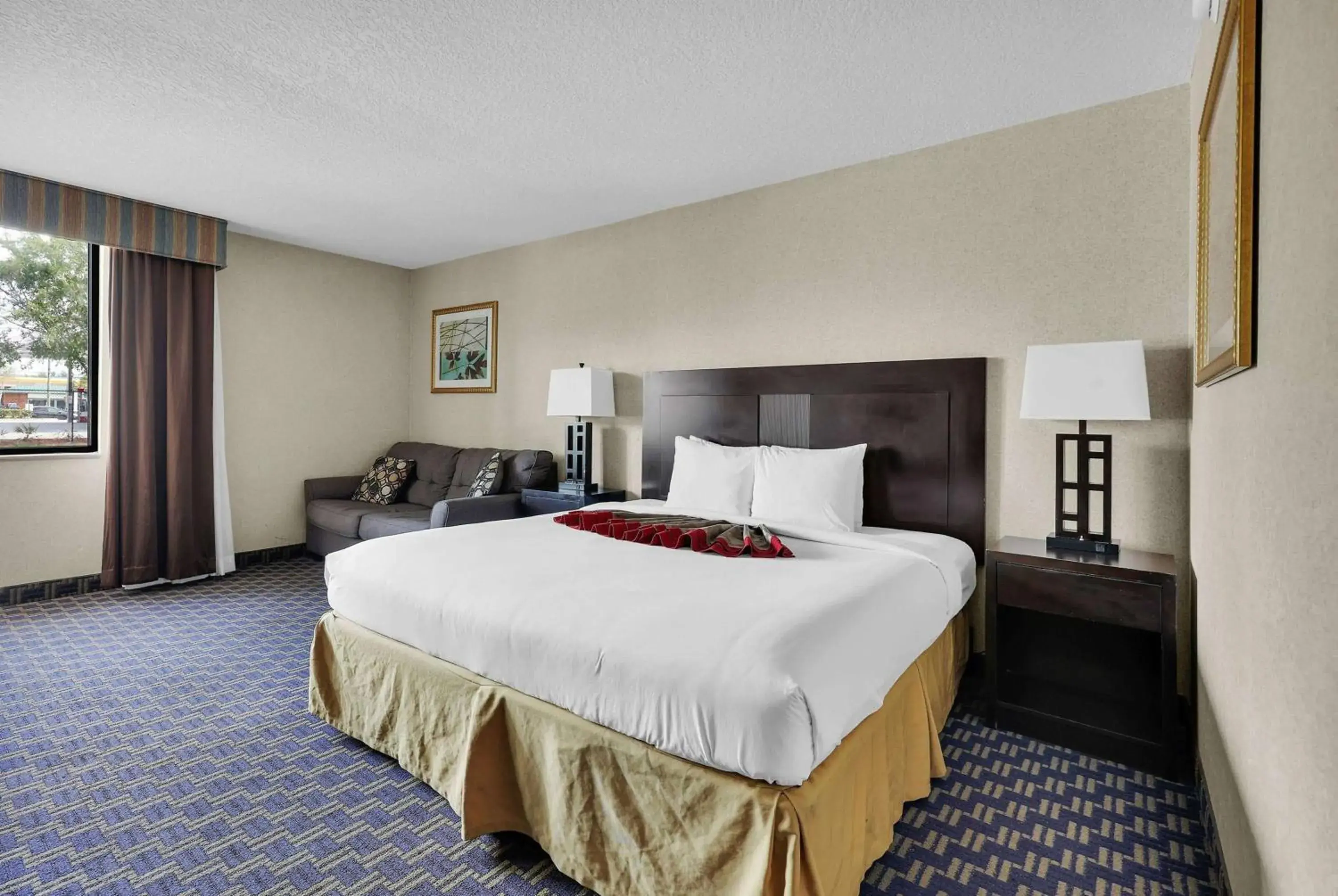 Photo of the whole room, Bed in Ramada by Wyndham Jacksonville I-95 by Butler Blvd