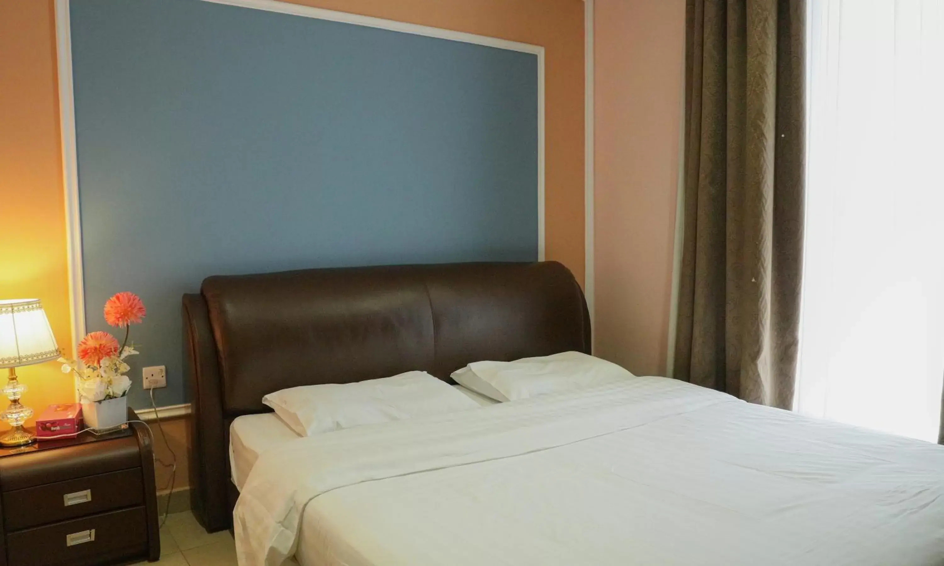 Bed in Laguna Hotel Suites