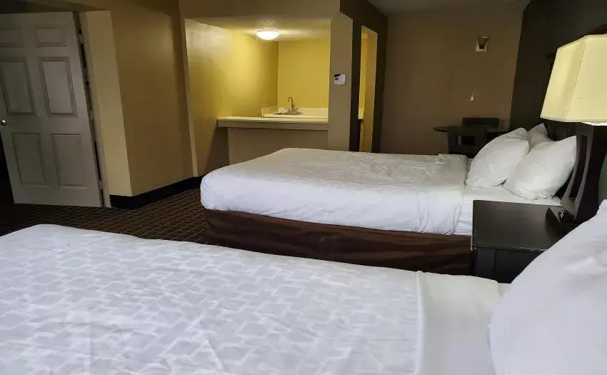 Bed in Clarion Inn & Suites