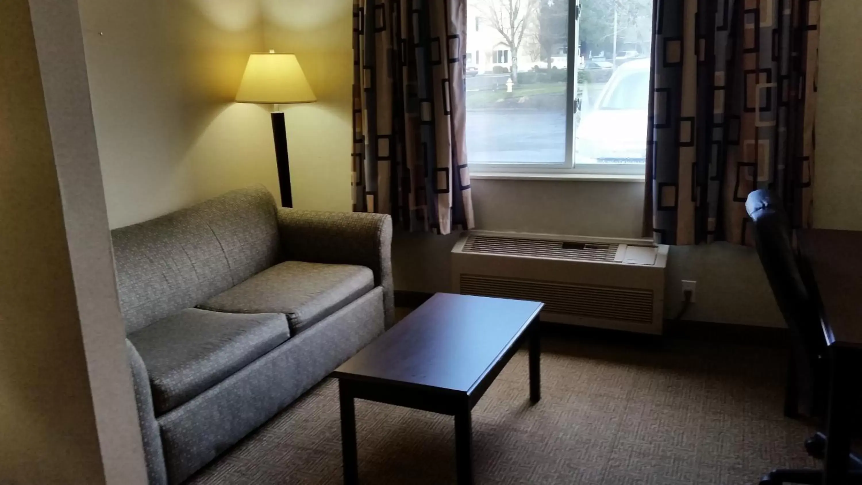 Living room, Seating Area in Days Inn & Suites by Wyndham Vancouver