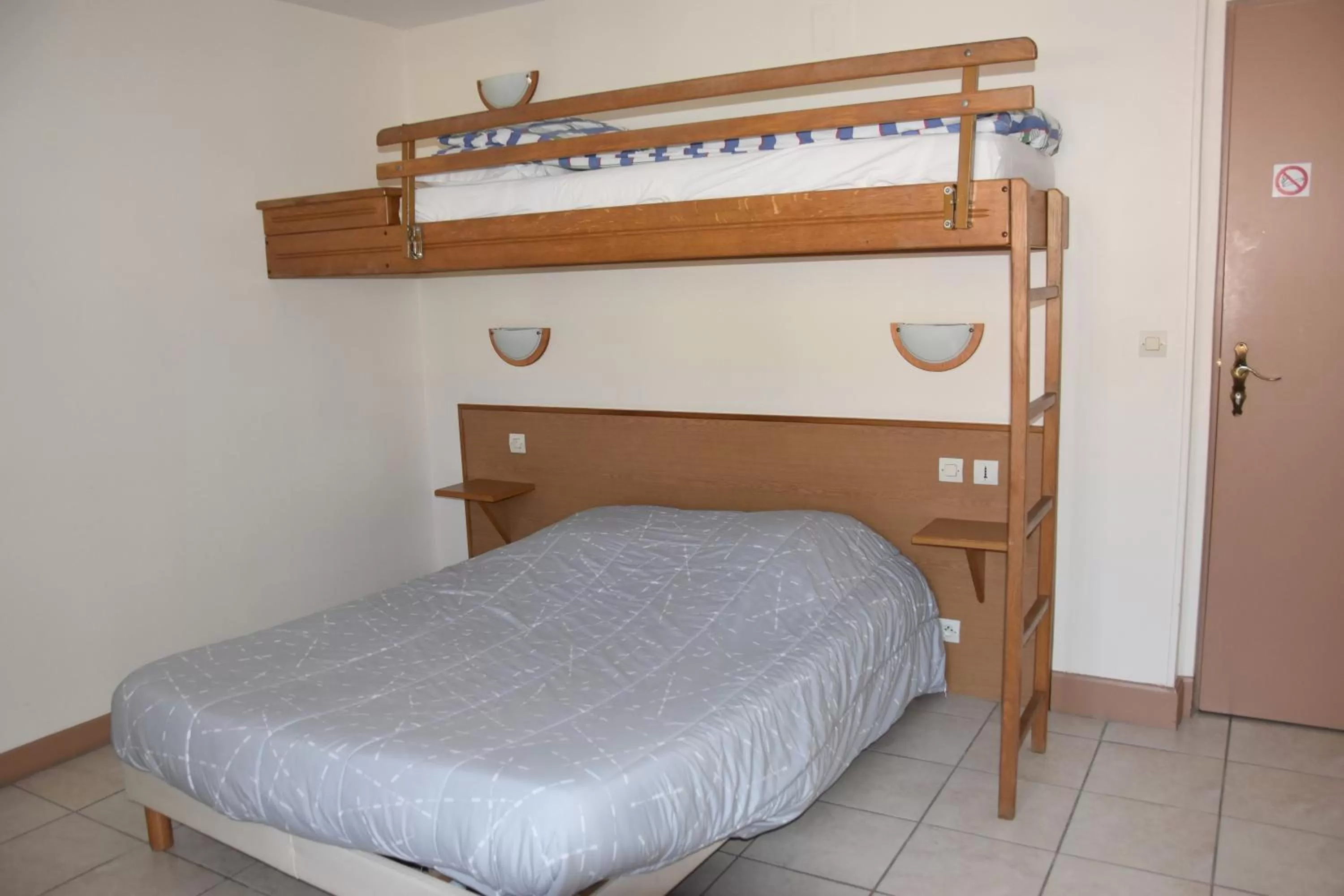 Bed in Hotel Gai Relais