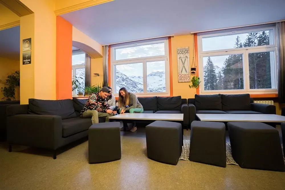 Communal lounge/ TV room, Seating Area in Arosa Mountain Lodge