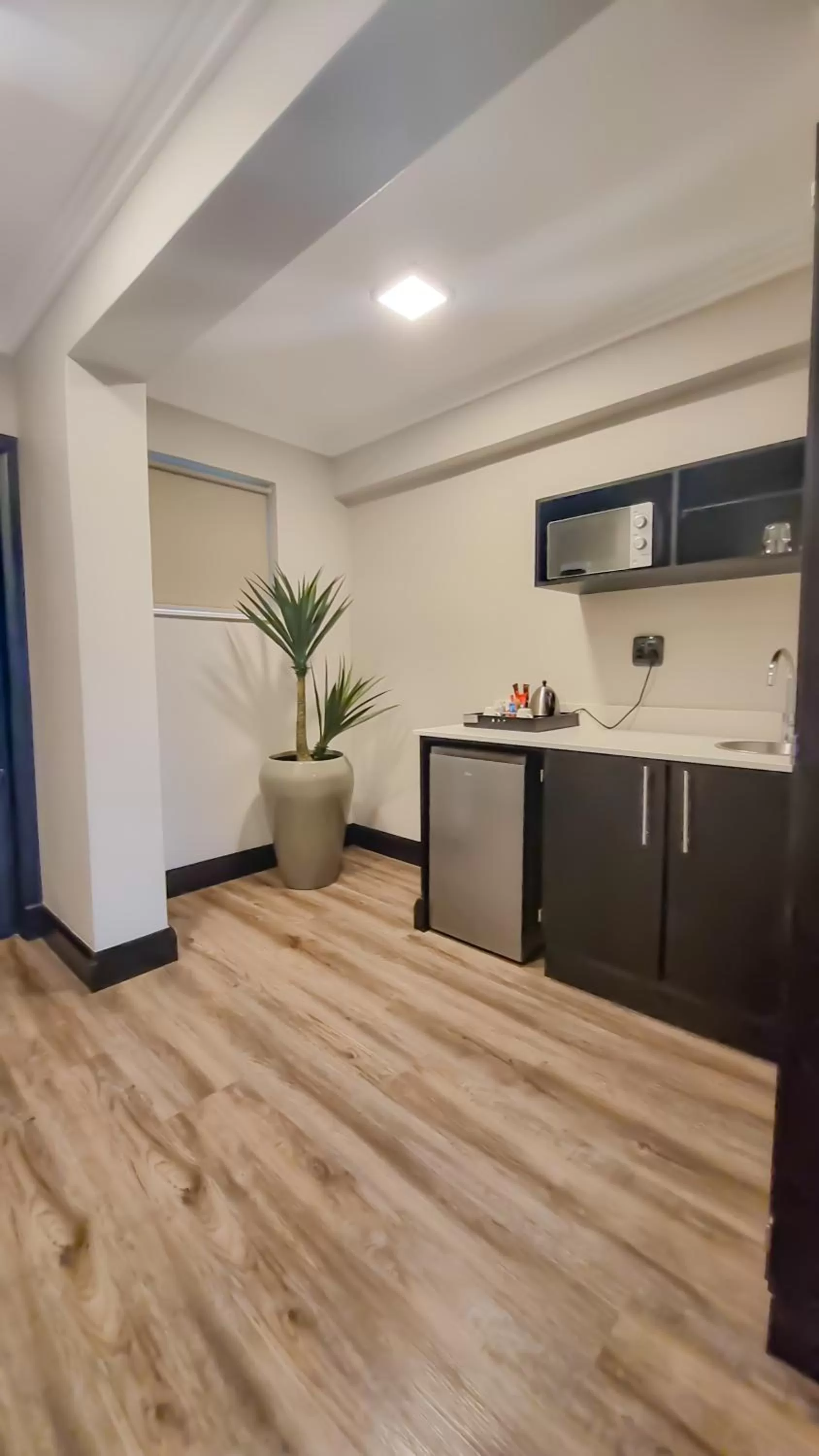 Kitchen or kitchenette in Belaire Suites Hotel