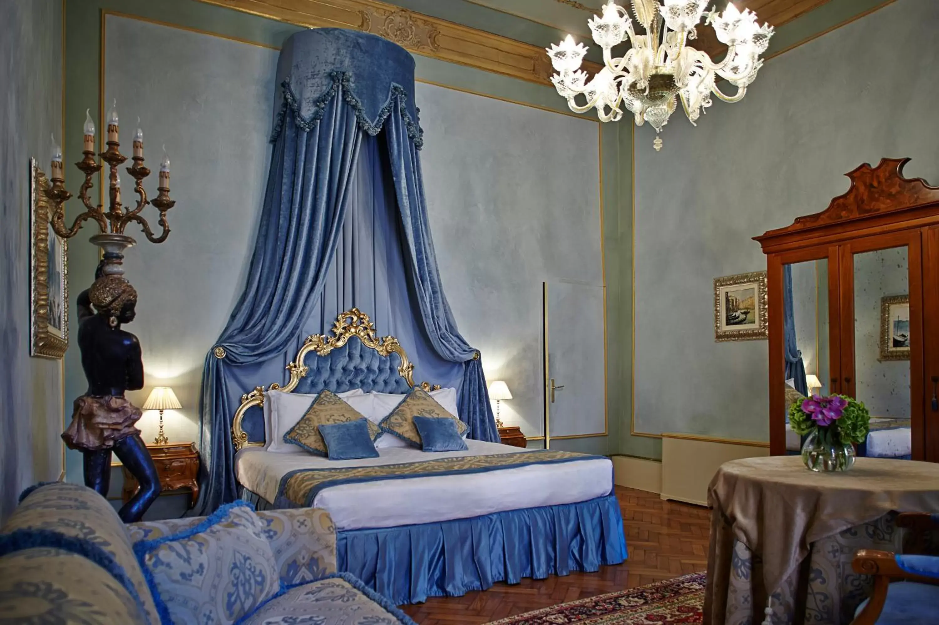Bed in Palazzo Paruta & Wellness Suites