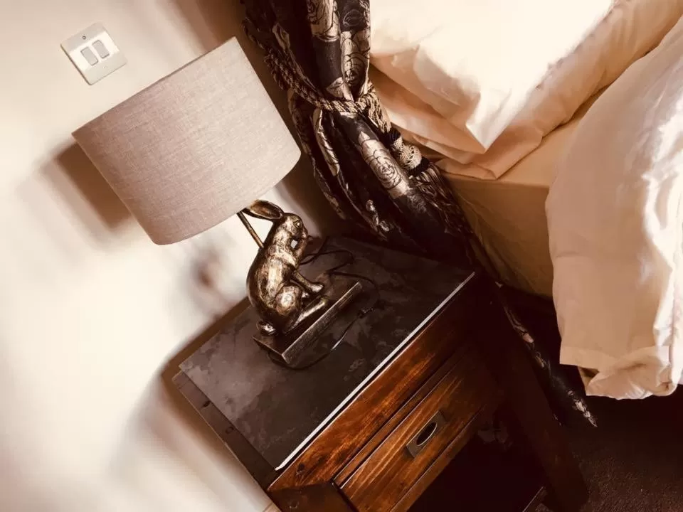 Bed in Brass Castle Country House Accommodation