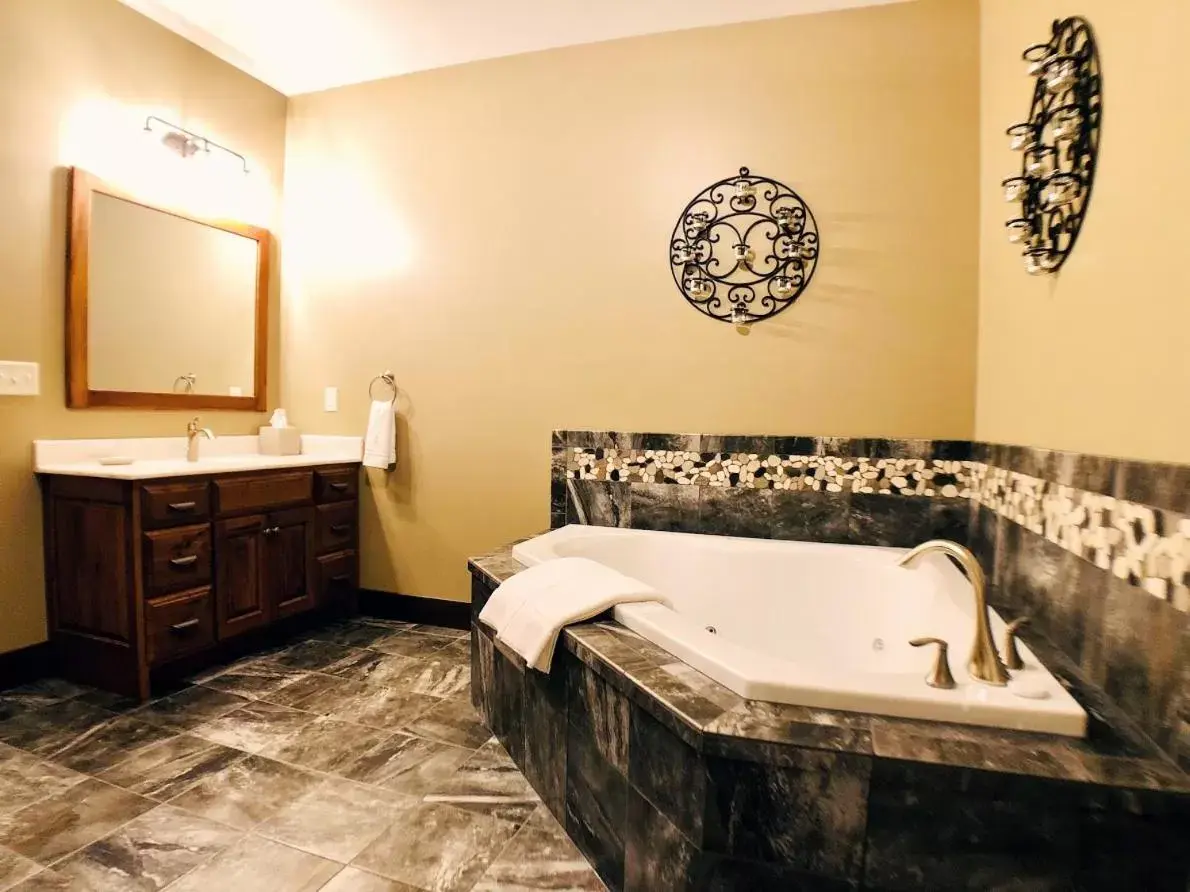 Bathroom in Sojourner's Lodge & Log Cabin Suites