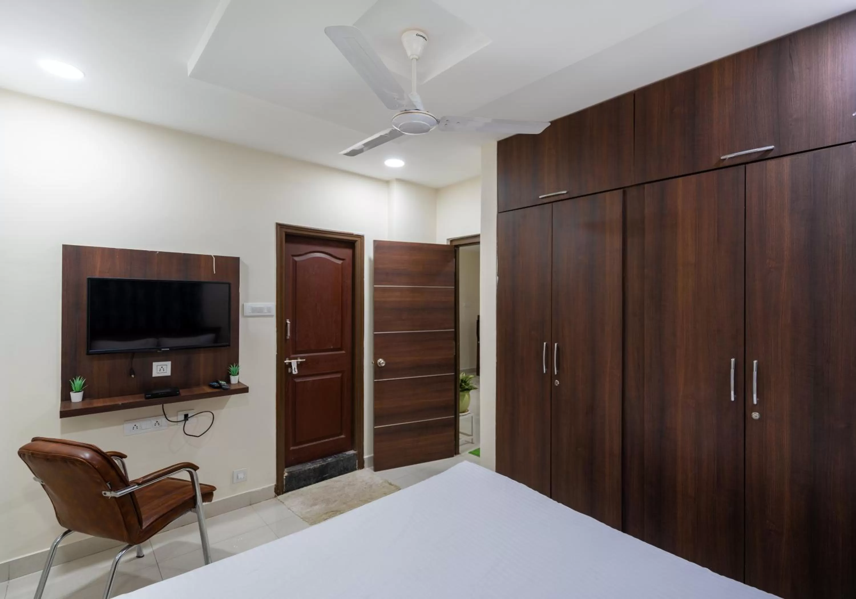 Living room, Bed in Hotel Voila Atnest Suites Kokapet, Business Hotel