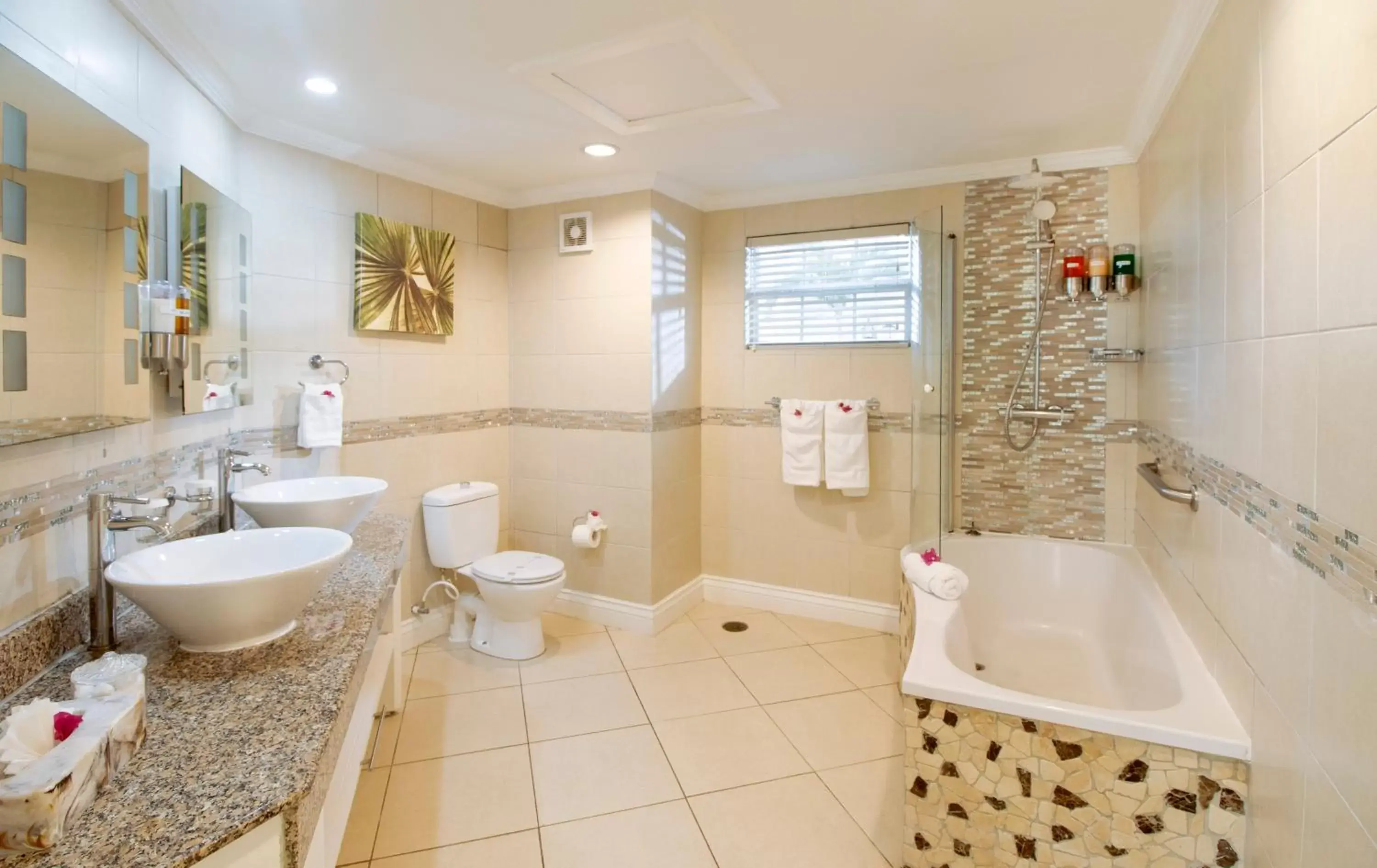 Bathroom in Bay Gardens Beach Resort & Spa Bathroom in Bay Gardens Beach Resort & Spa