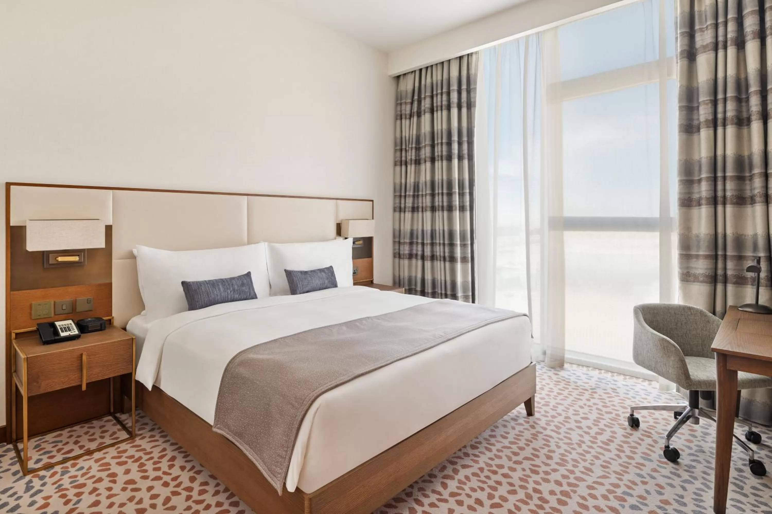 Photo of the whole room, Bed in Staybridge Suites Dubai Al-Maktoum Airport by IHG