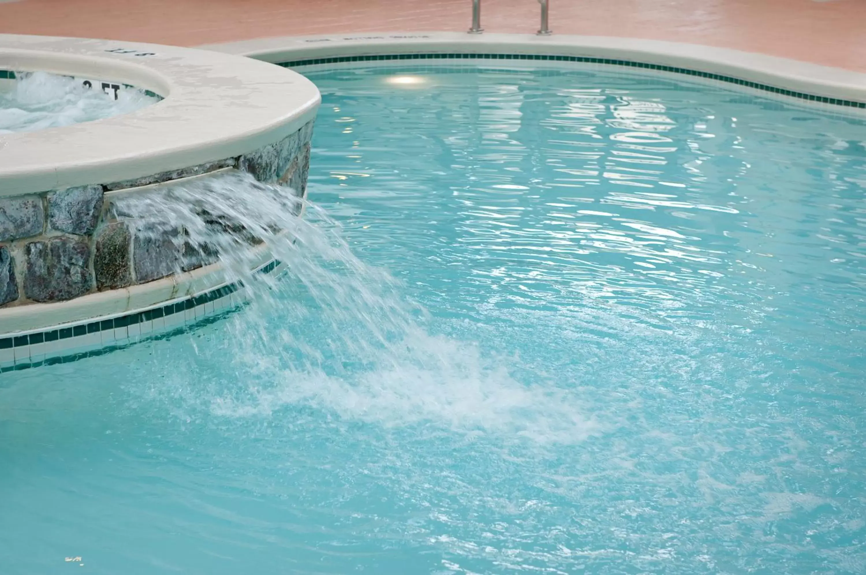 Hot Tub, Swimming Pool in Ramada by Wyndham State College Hotel & Conference Center