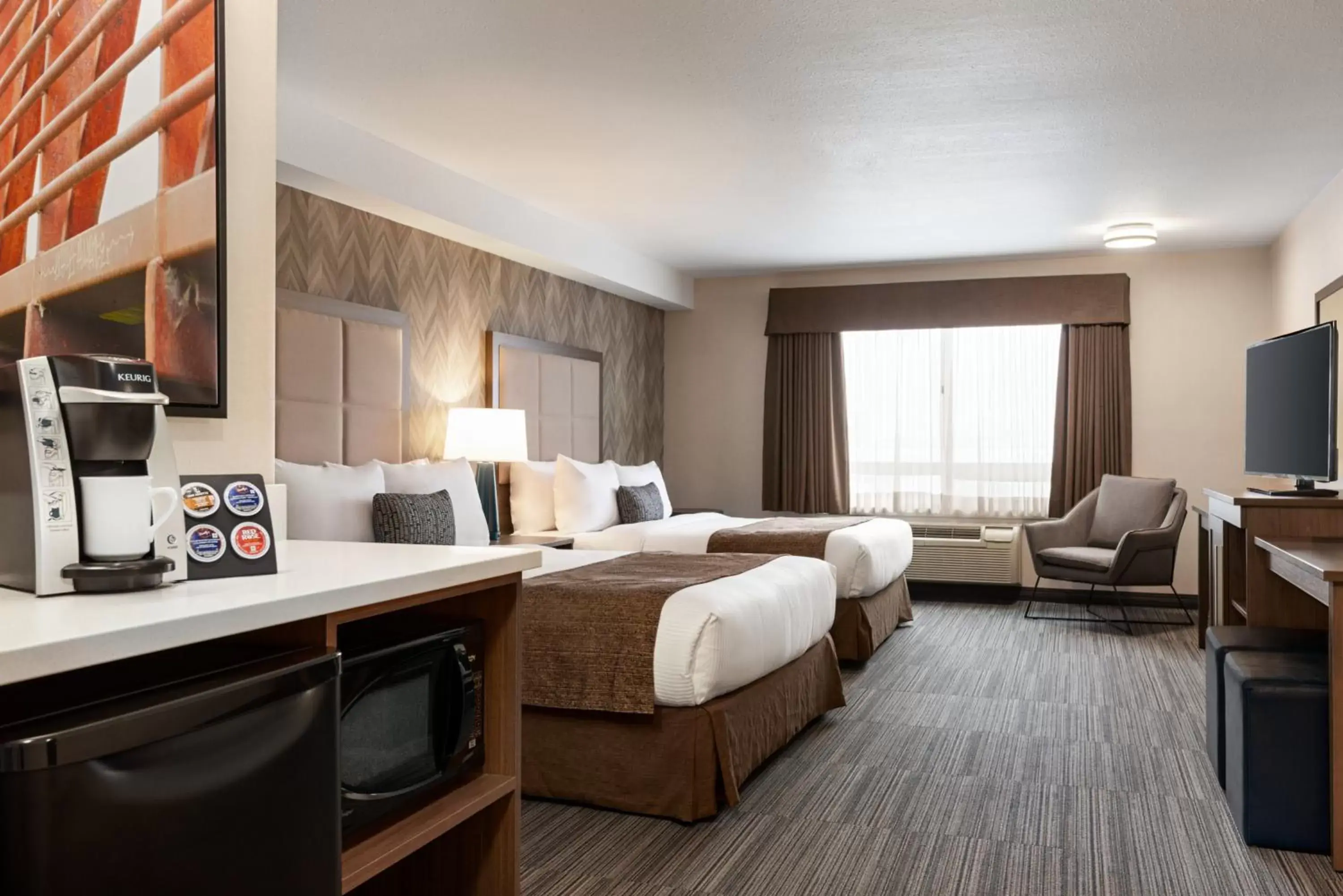 Photo of the whole room, TV/Entertainment Center in Ramada by Wyndham Airdrie Hotel & Suites