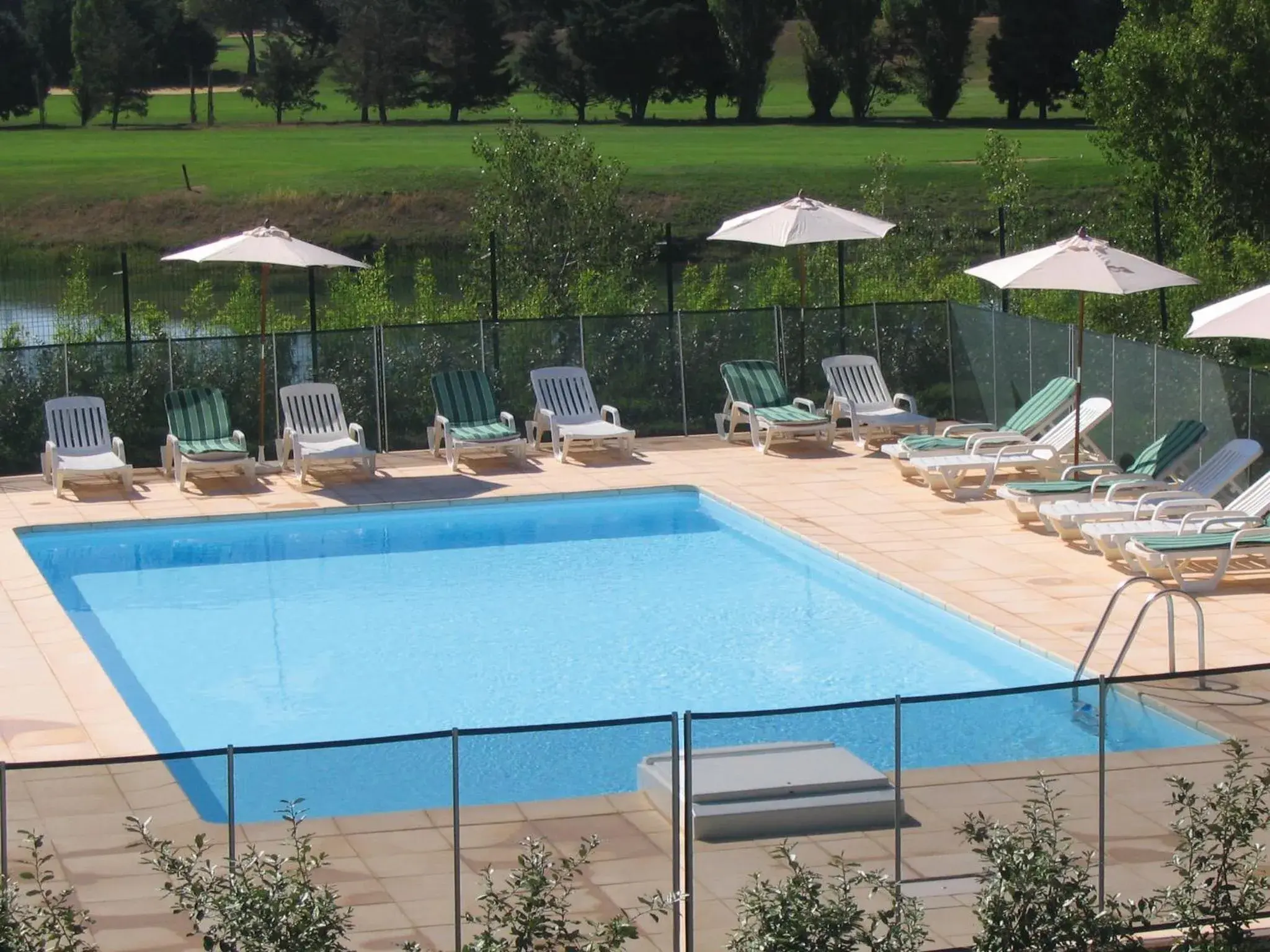 Balcony/Terrace, Swimming Pool in Residhotel Golf Grand Avignon