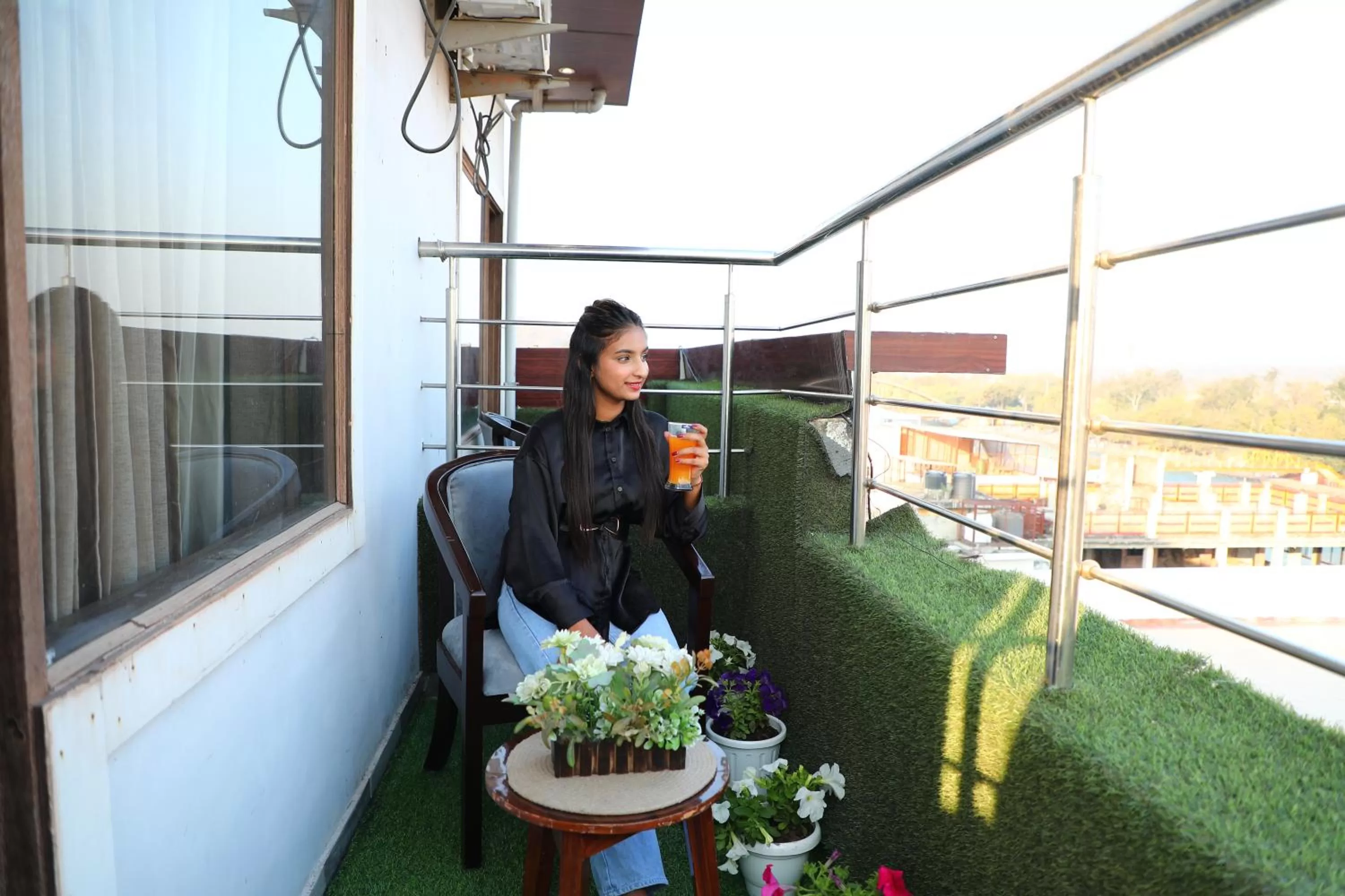 People in Perfectstayz Premium Ganga Heights - Ganga View rooftop cafe