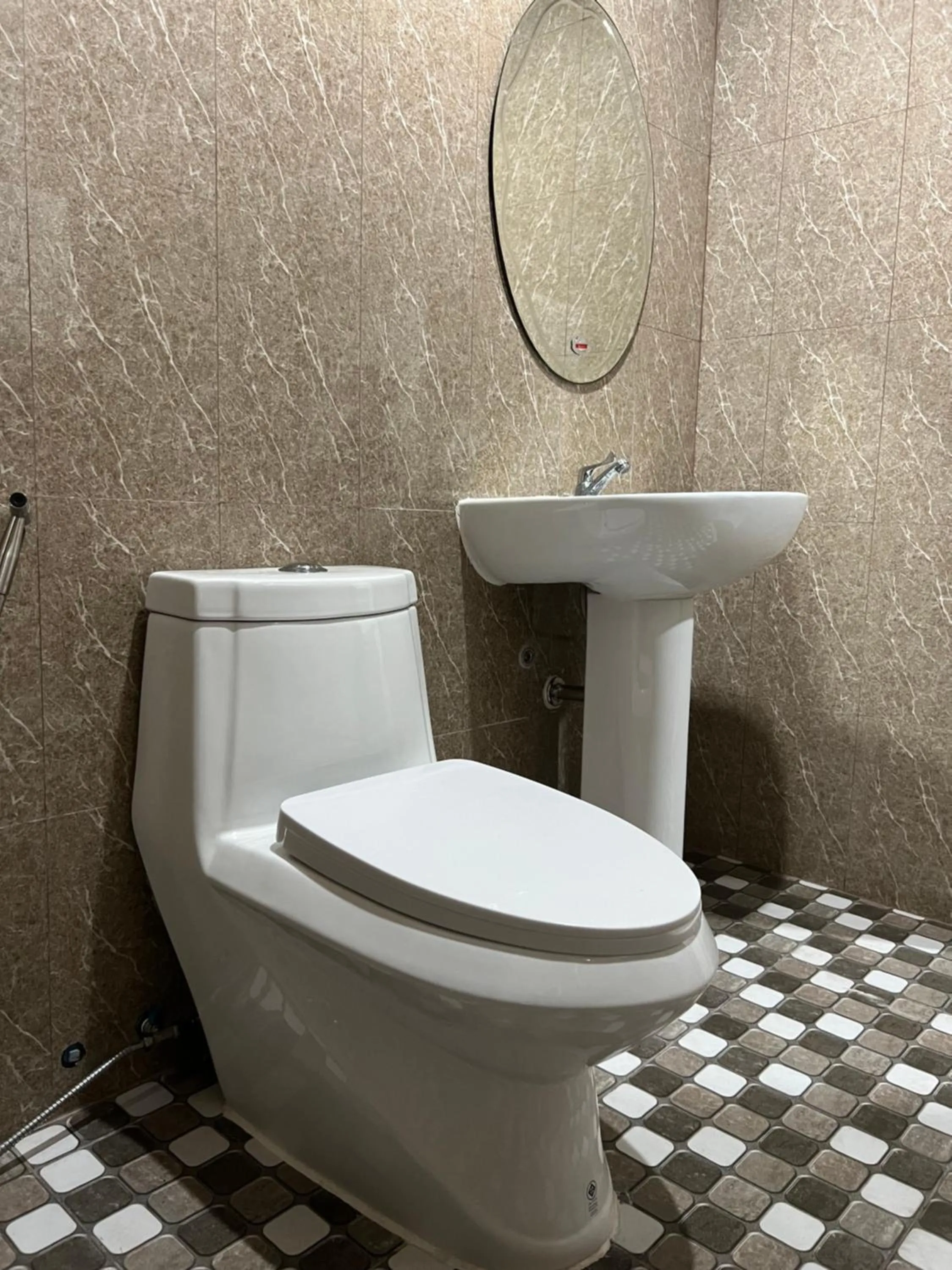 Toilet in Mall Suites Hotel