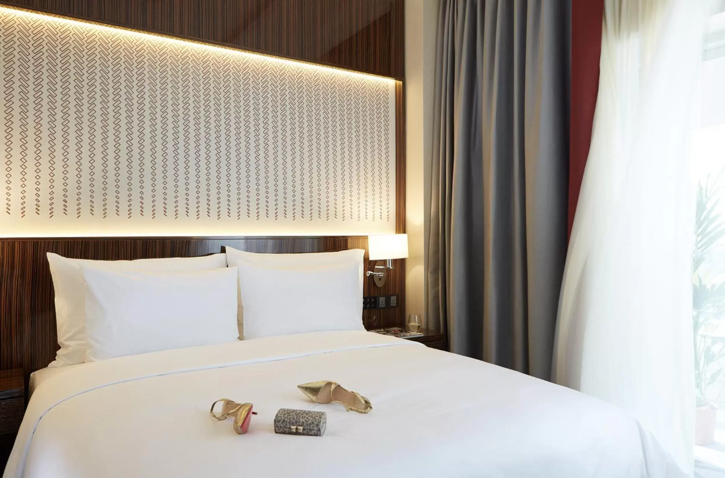 Bed in Dusit D2 Kenz Hotel Dubai