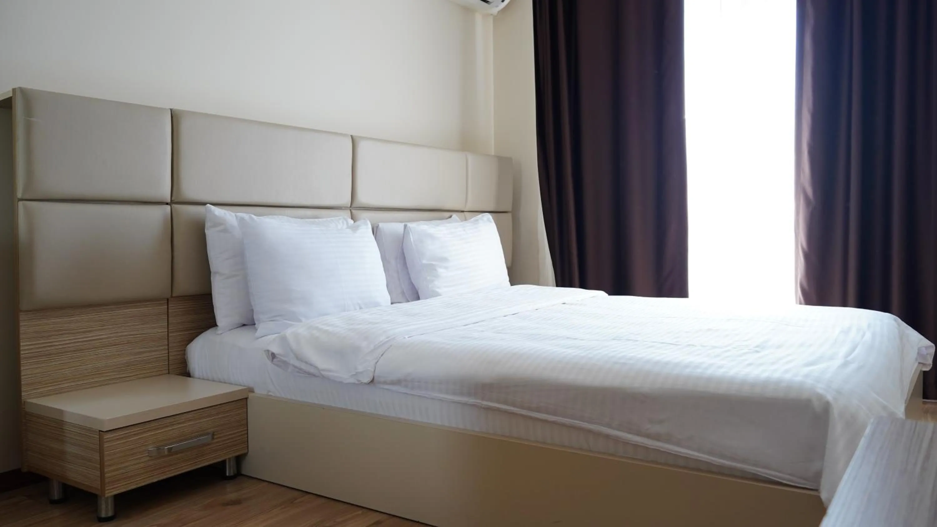 Bed in Overland Residence