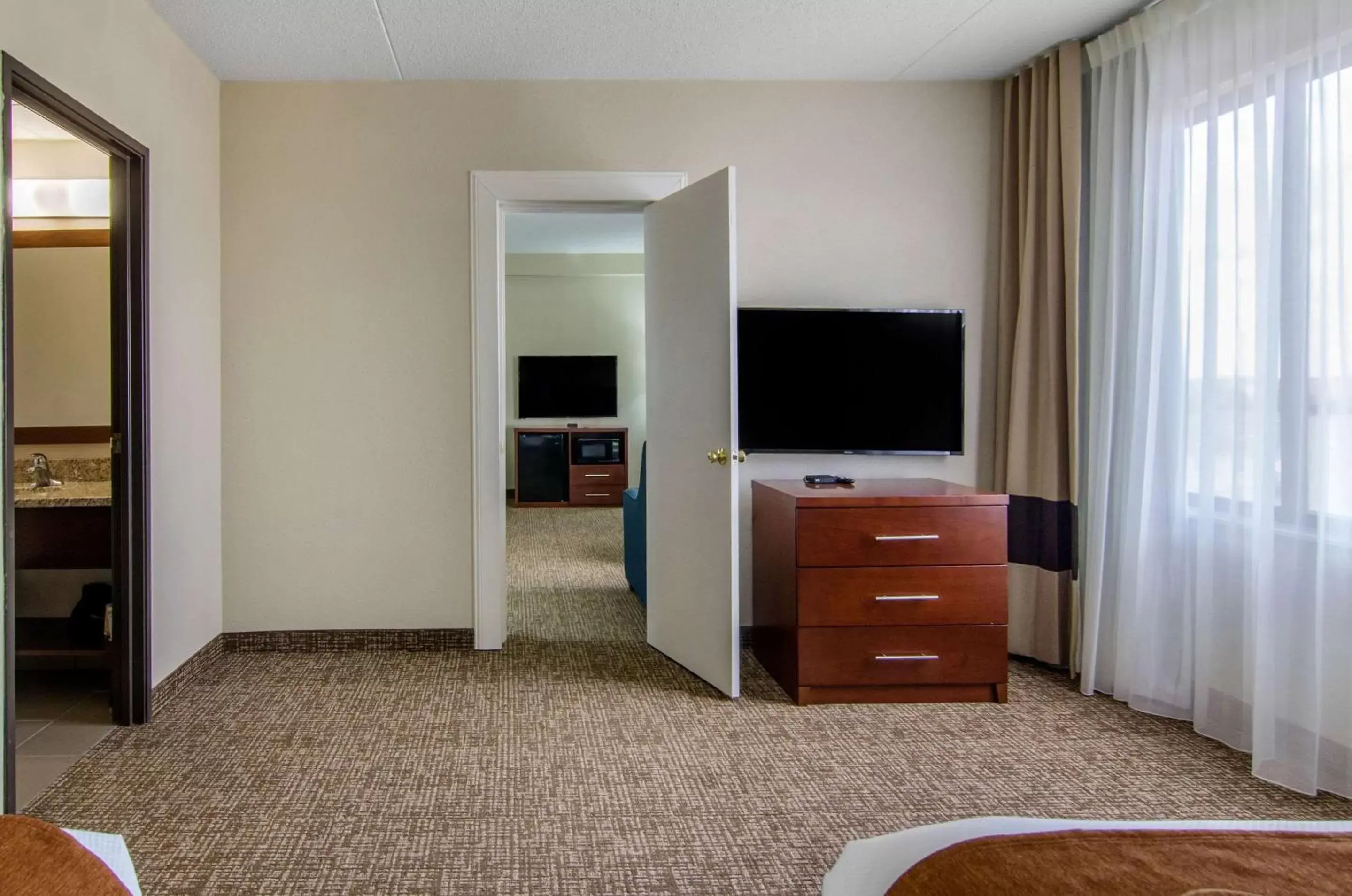 Photo of the whole room, TV/Entertainment Center in Comfort Inn & Suites