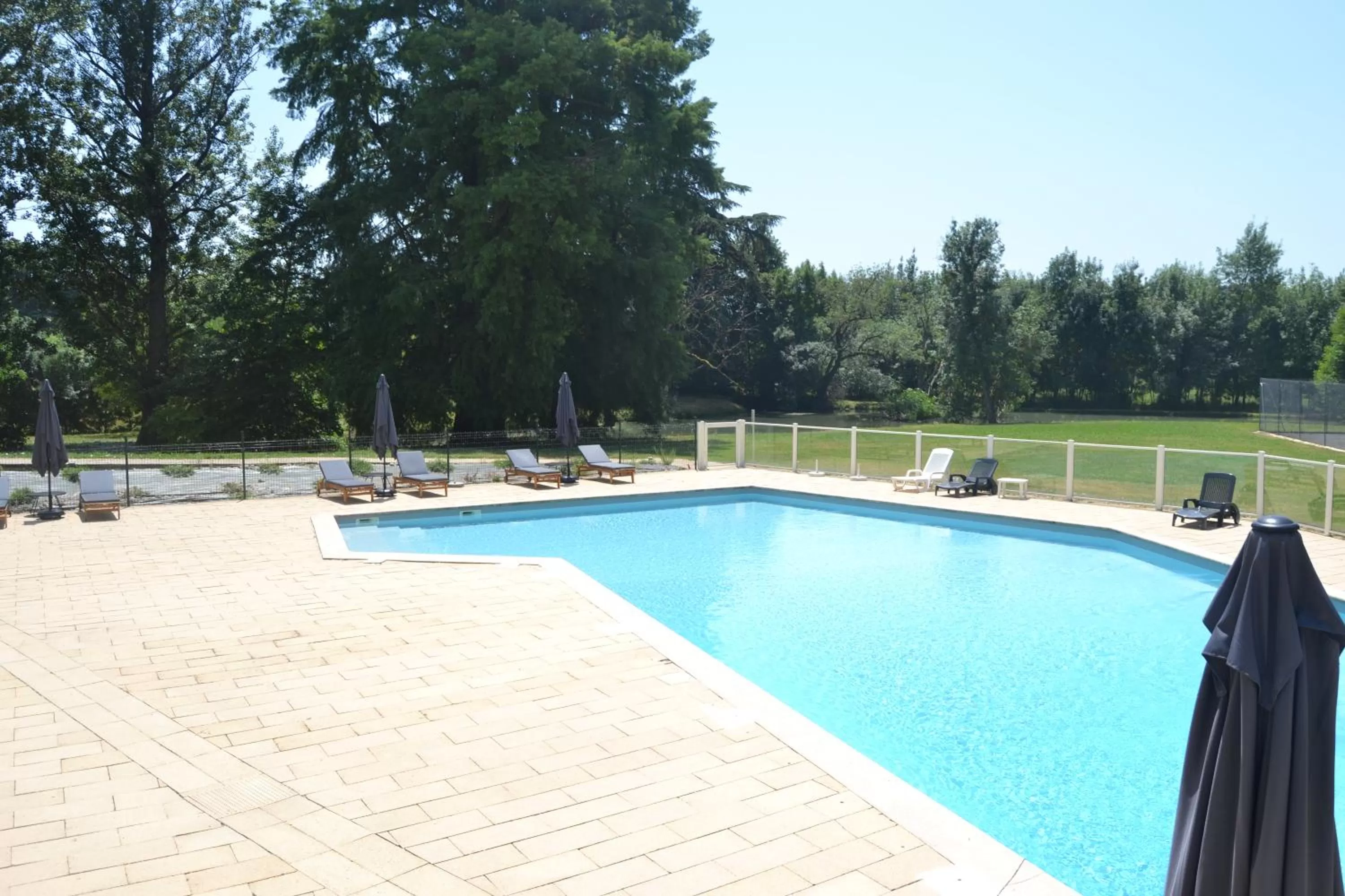 Swimming pool in Logis Hotels - Château Saint Marcel