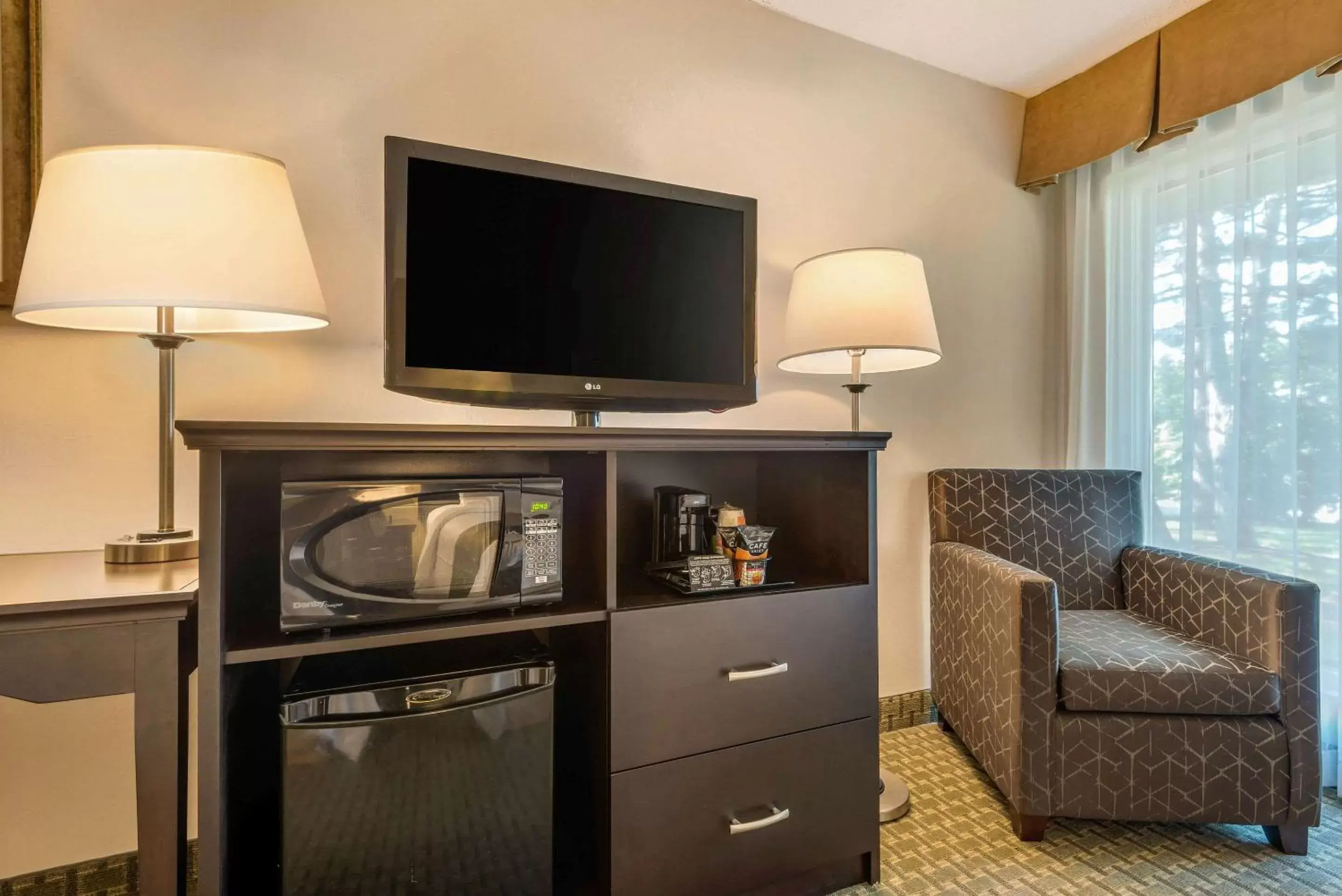 Photo of the whole room, TV/Entertainment Center in Quality Inn & Suites