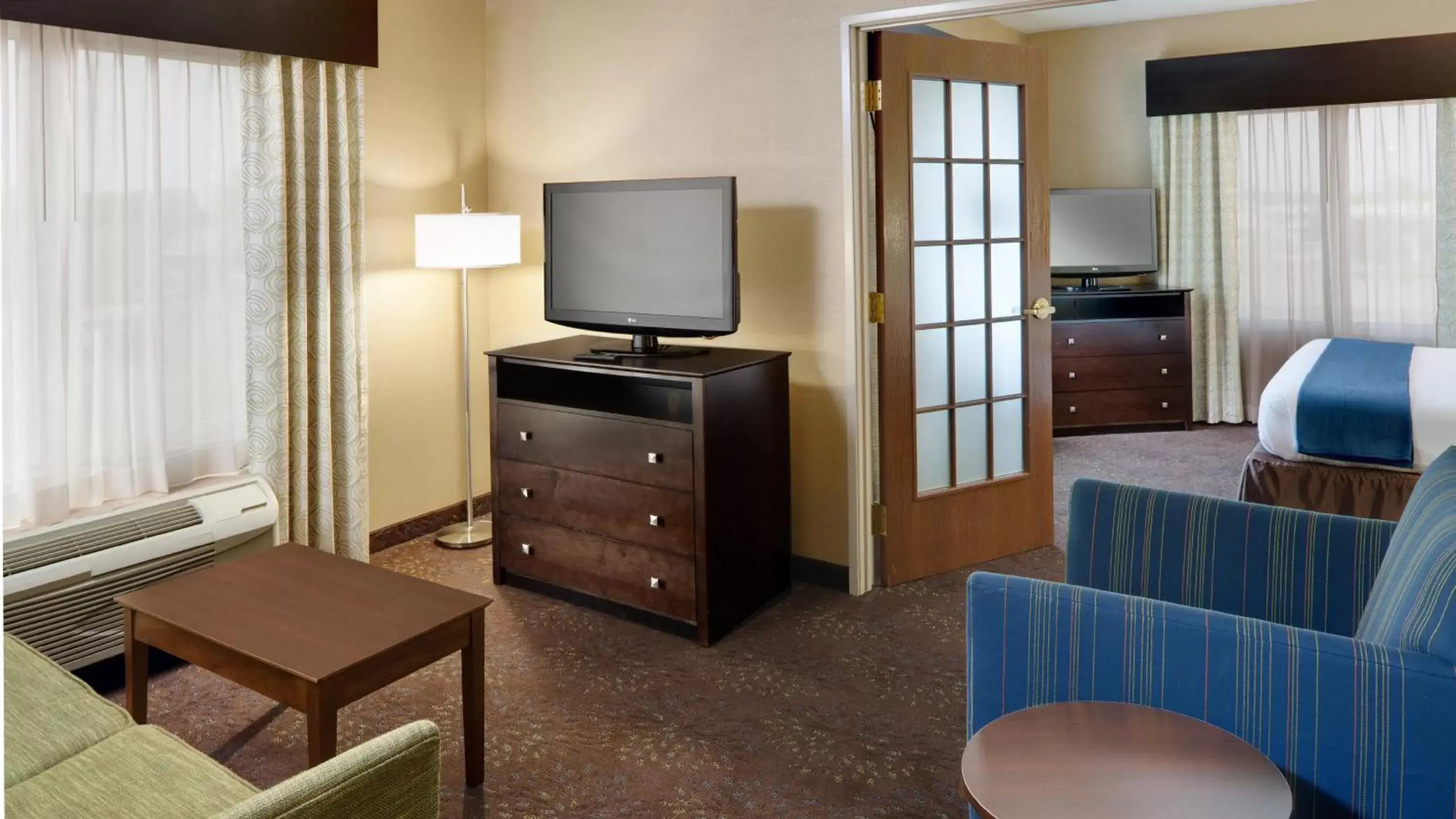 Photo of the whole room, TV/Entertainment Center in Holiday Inn Express Hotel & Suites Saginaw, an IHG Hotel