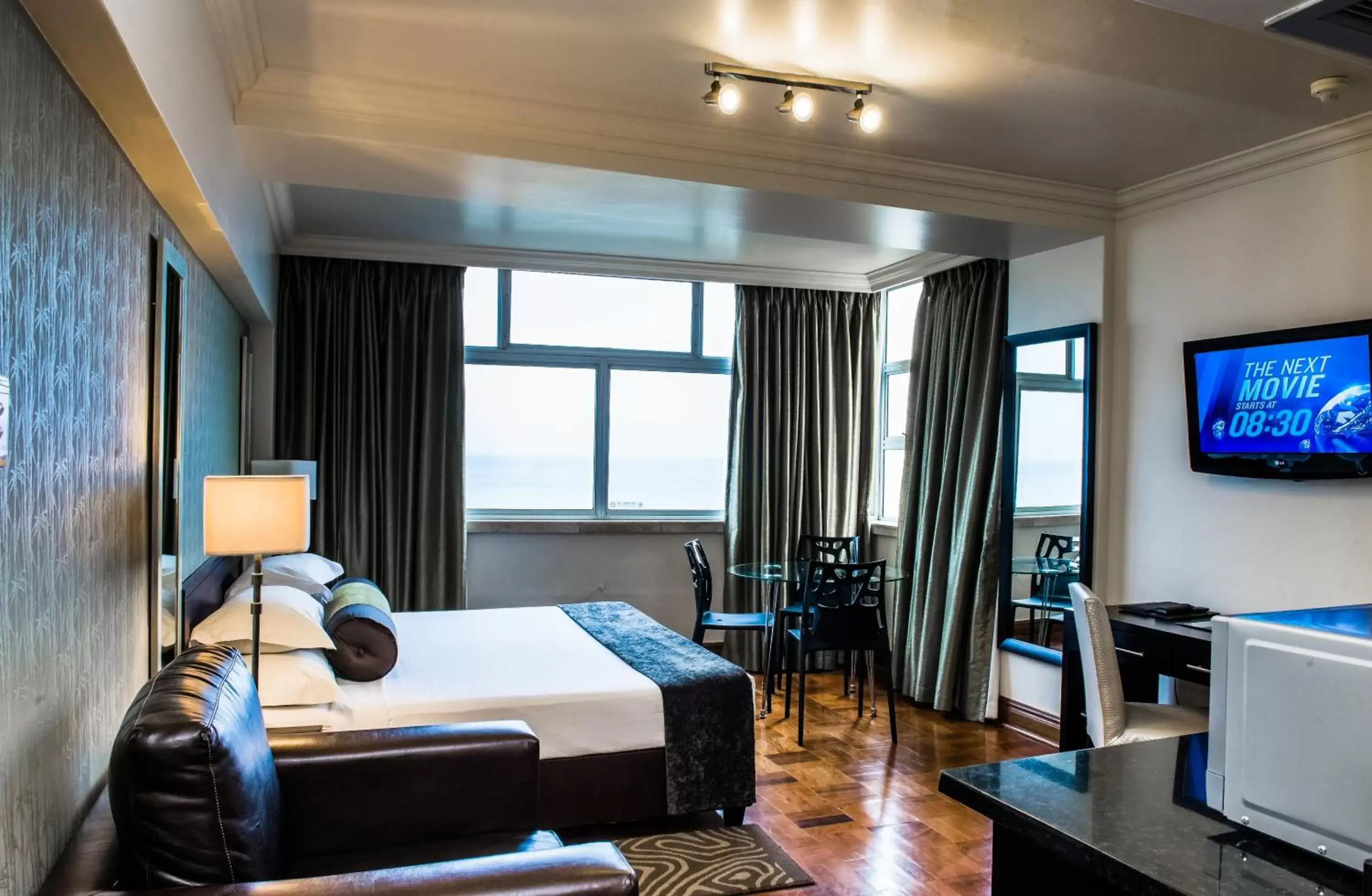 Bedroom in Belaire Suites Hotel