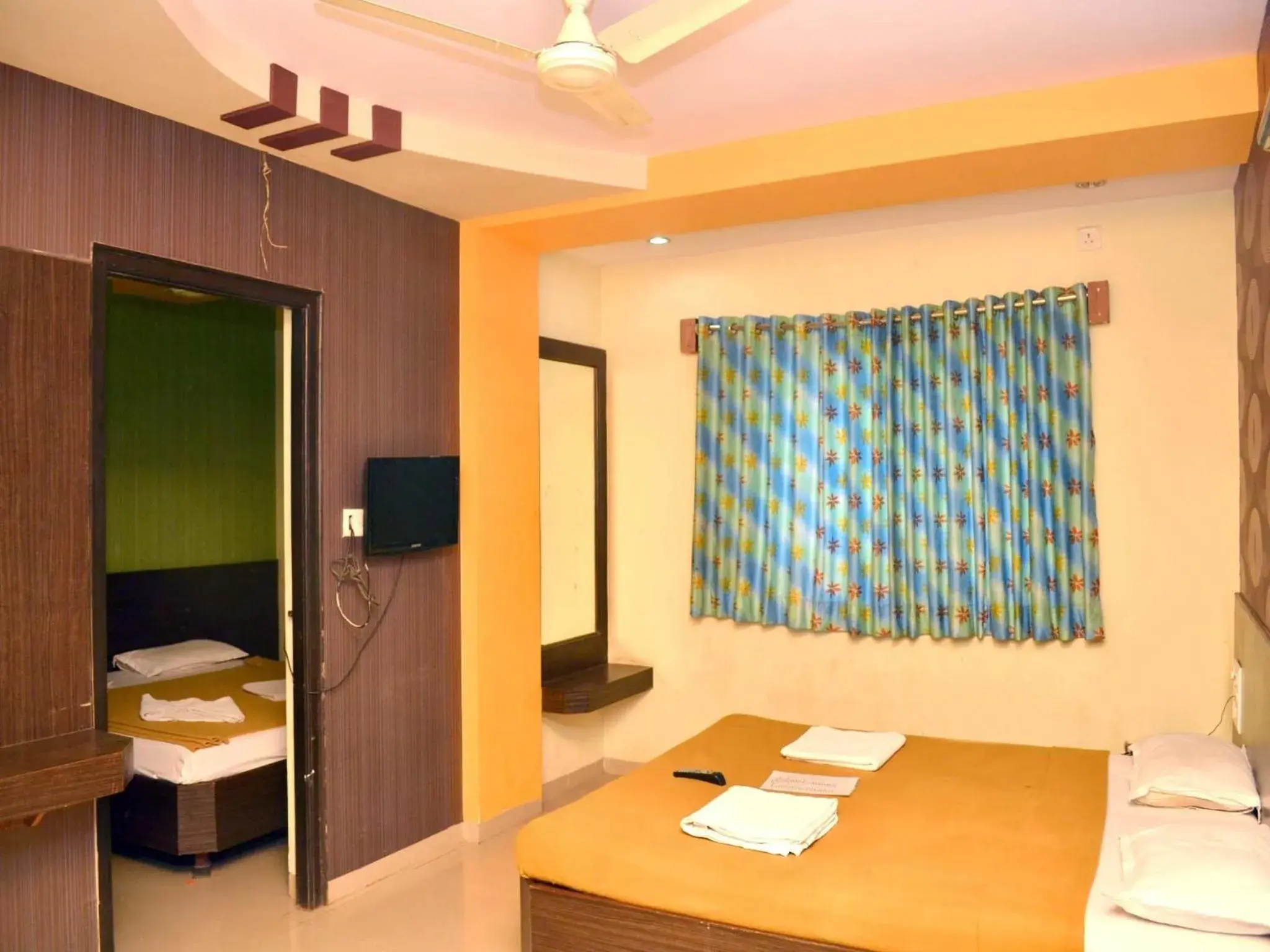 Bedroom, TV/Entertainment Center in Hotel Sai Kamal