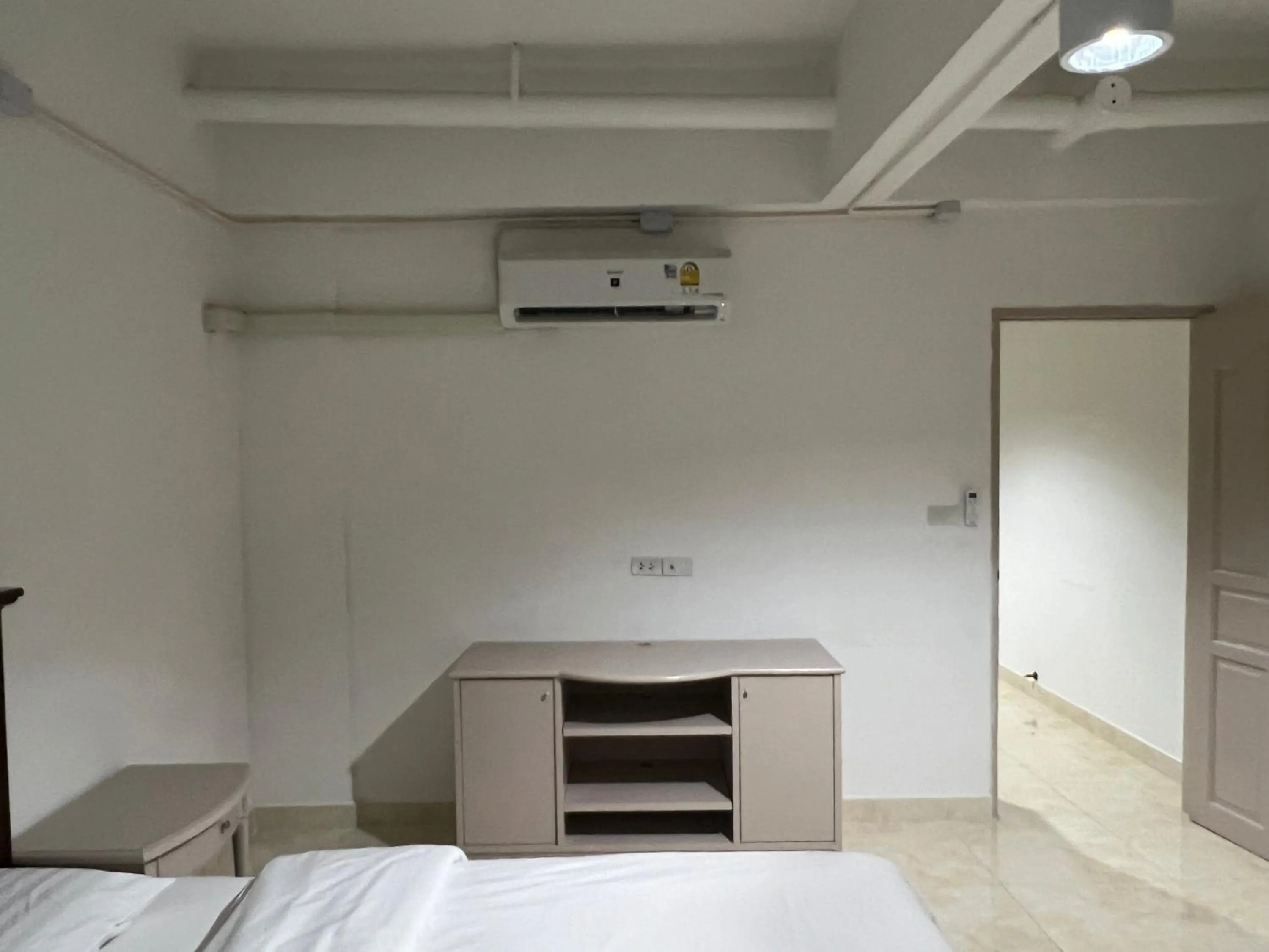 Bed in Mall Suites Hotel