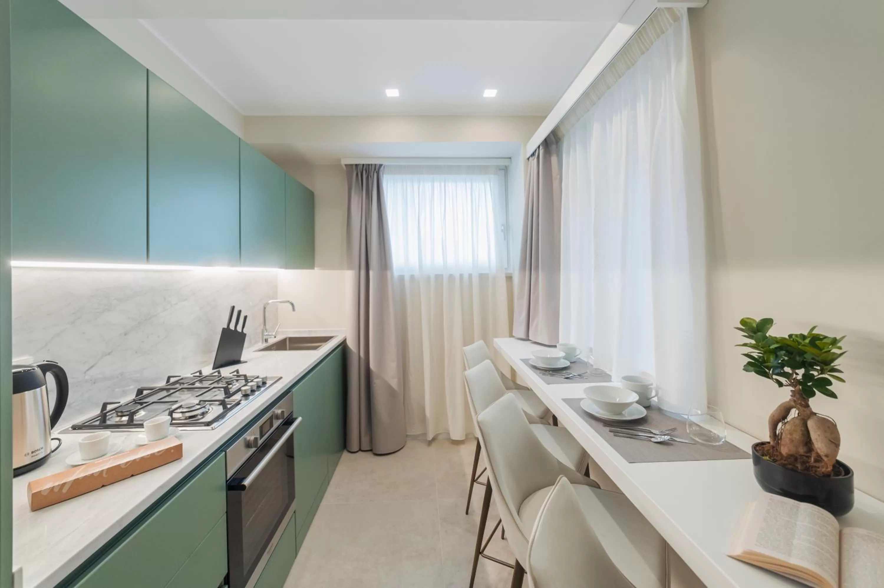 Kitchen or kitchenette in Naxi Suites
