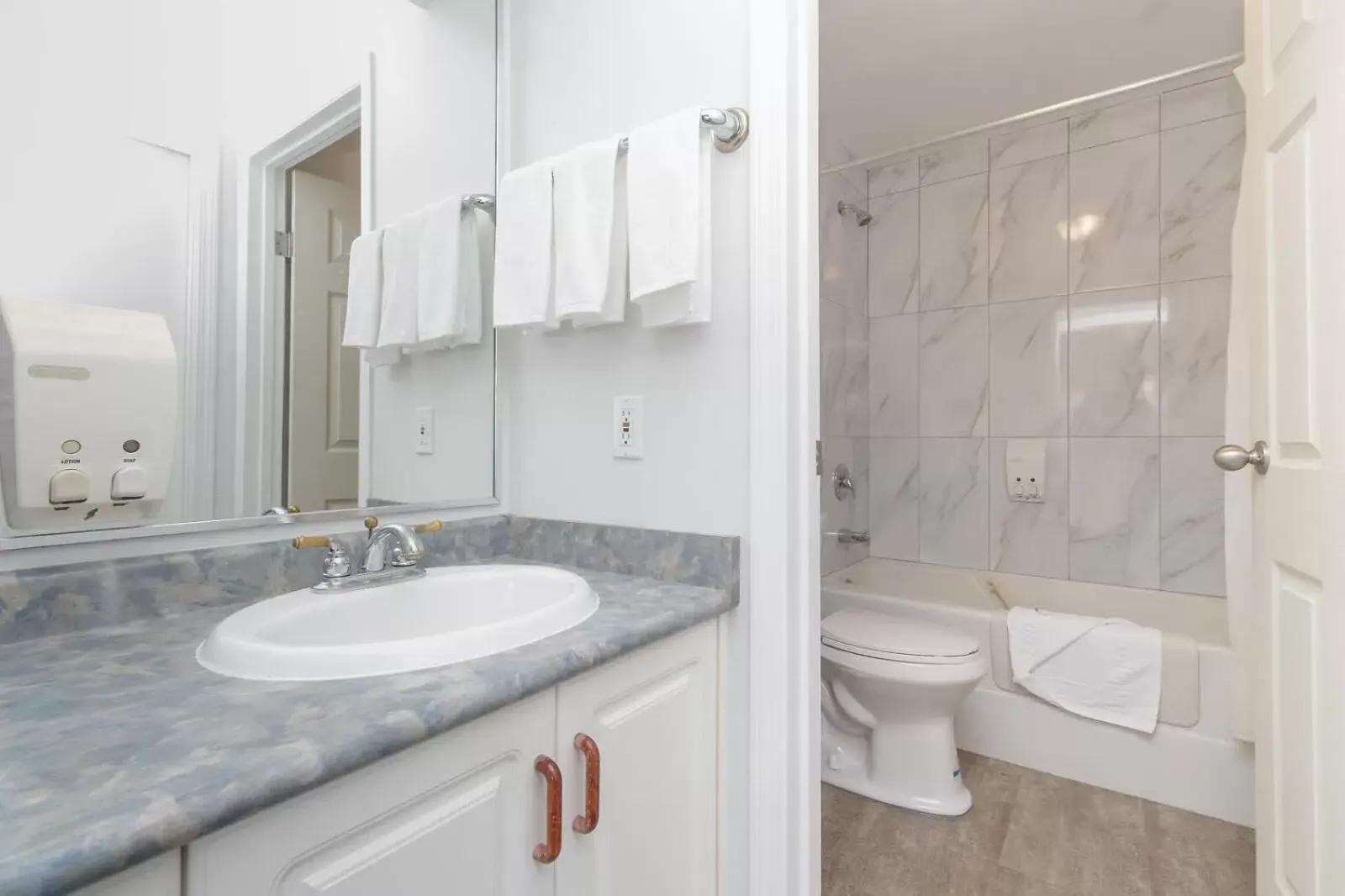 Bathroom in The Cedarwood Inn & Suites