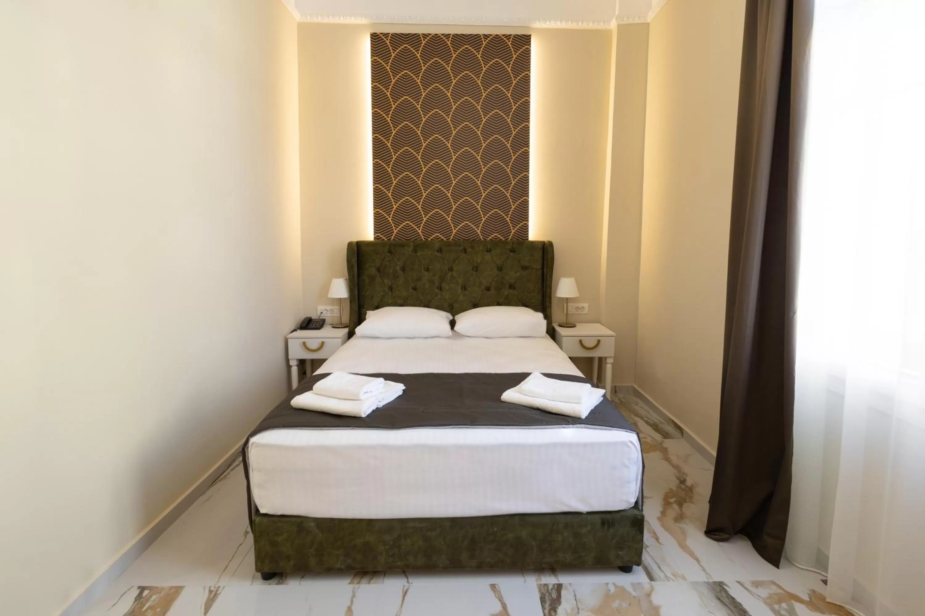 Bed in Modern Revival Luxury Hotel