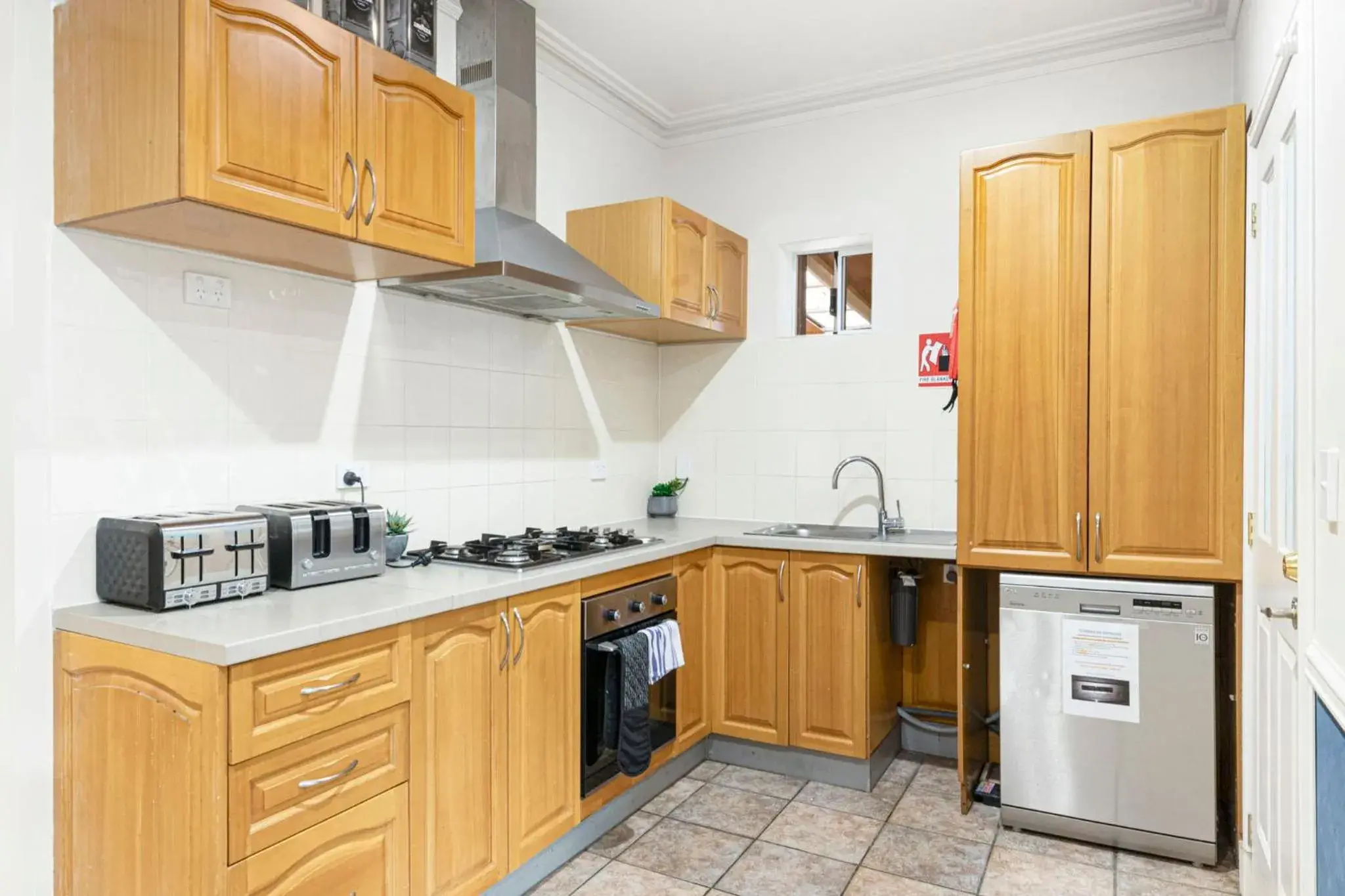 Kitchen/Kitchenette in Inn The Tuarts Guest Lodge Busselton Accommodation - Adults Only
