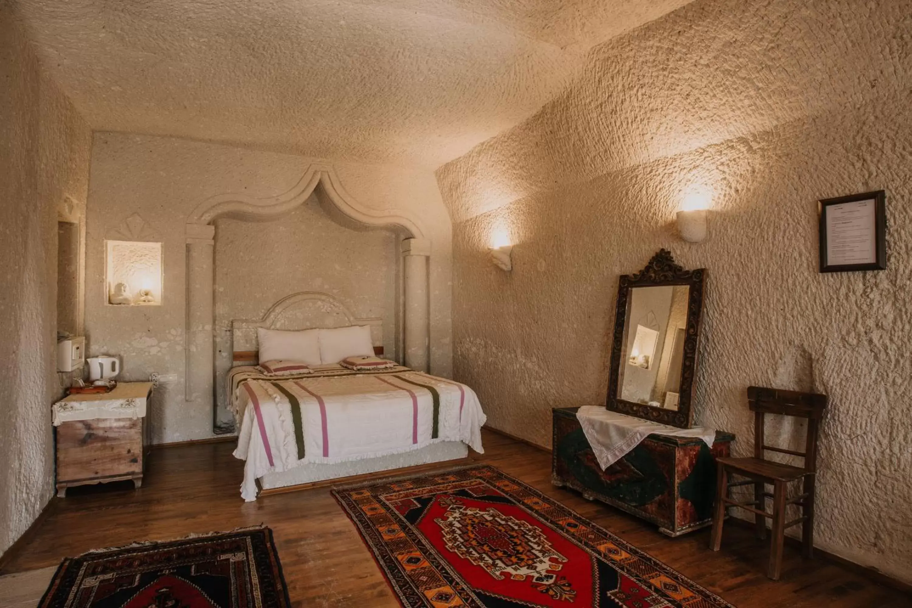 Bed in Village Cave House Hotel