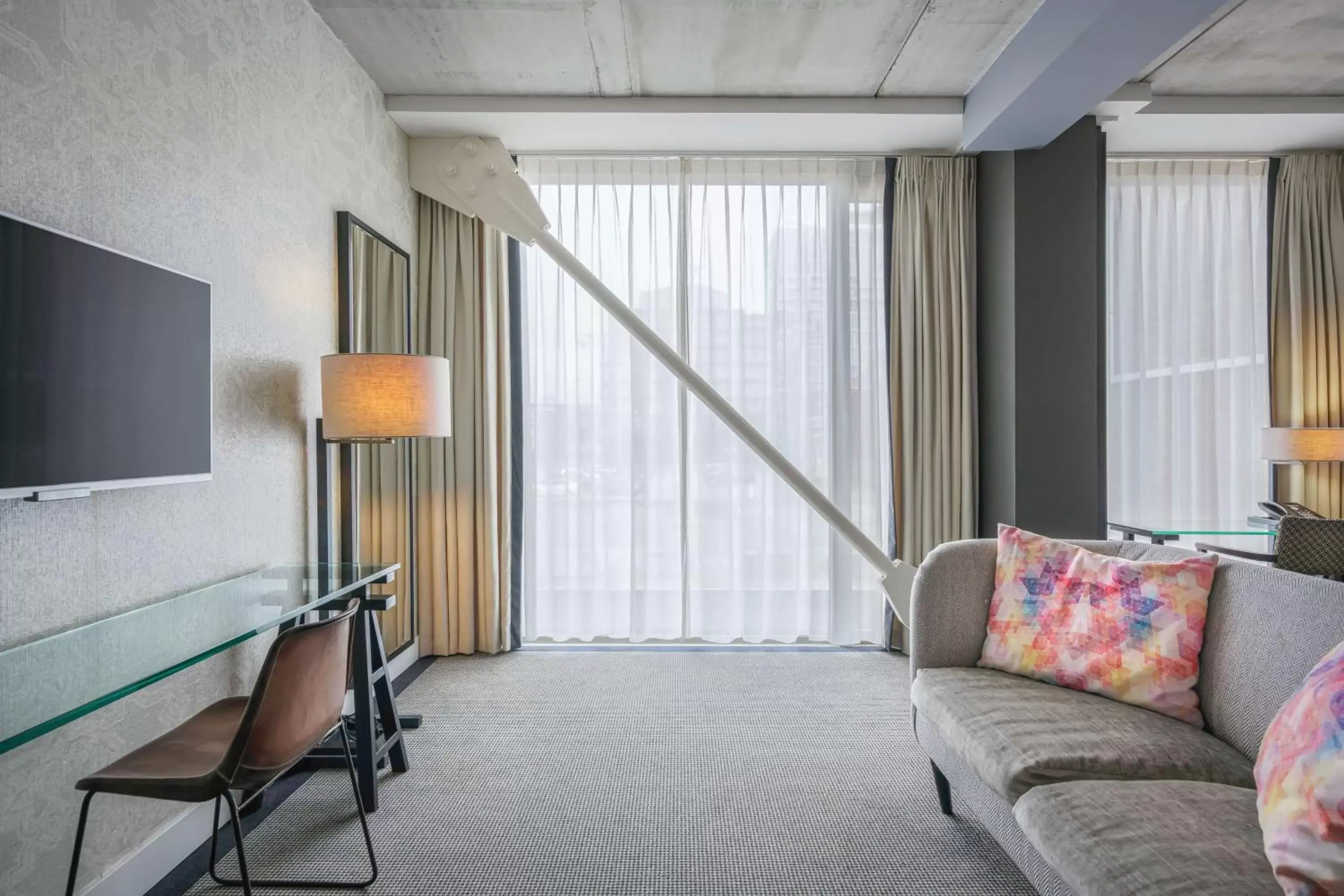 Living room, TV/Entertainment Center in DoubleTree By Hilton Hotel Amsterdam - Ndsm Wharf