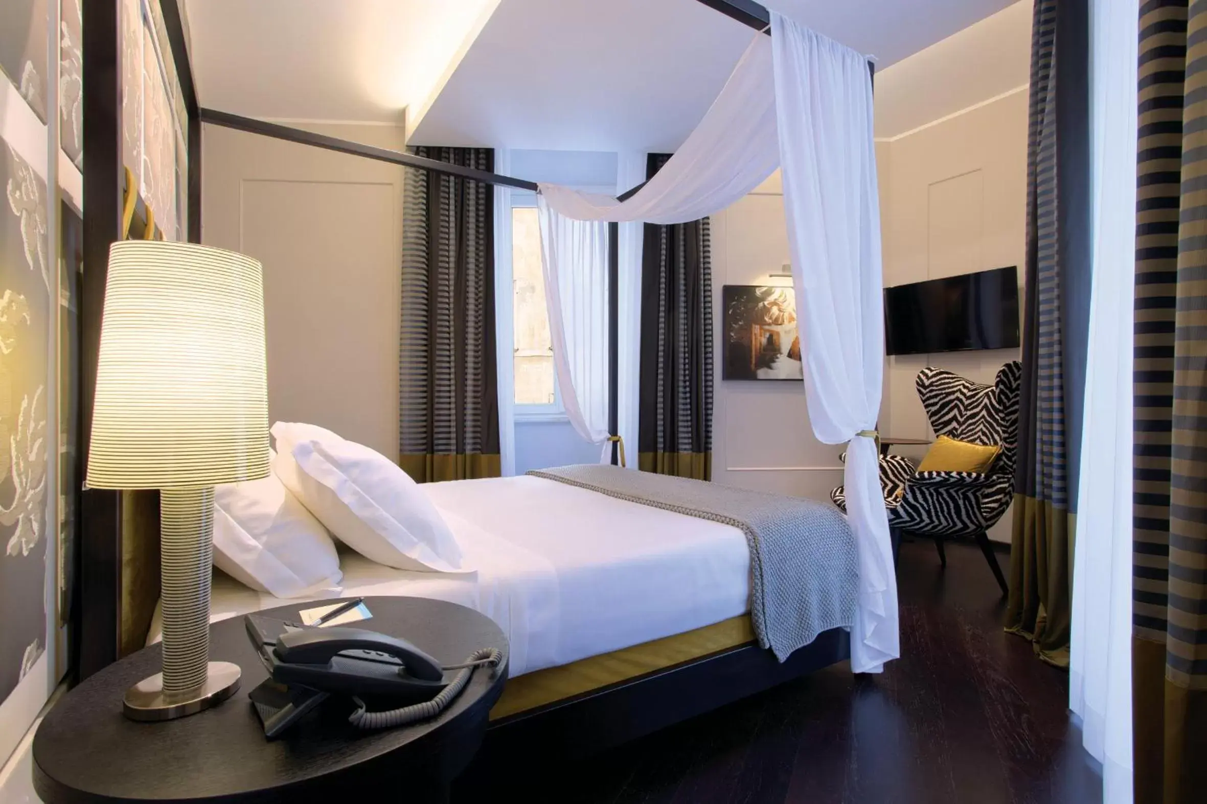 Bed in Stendhal Luxury Suites