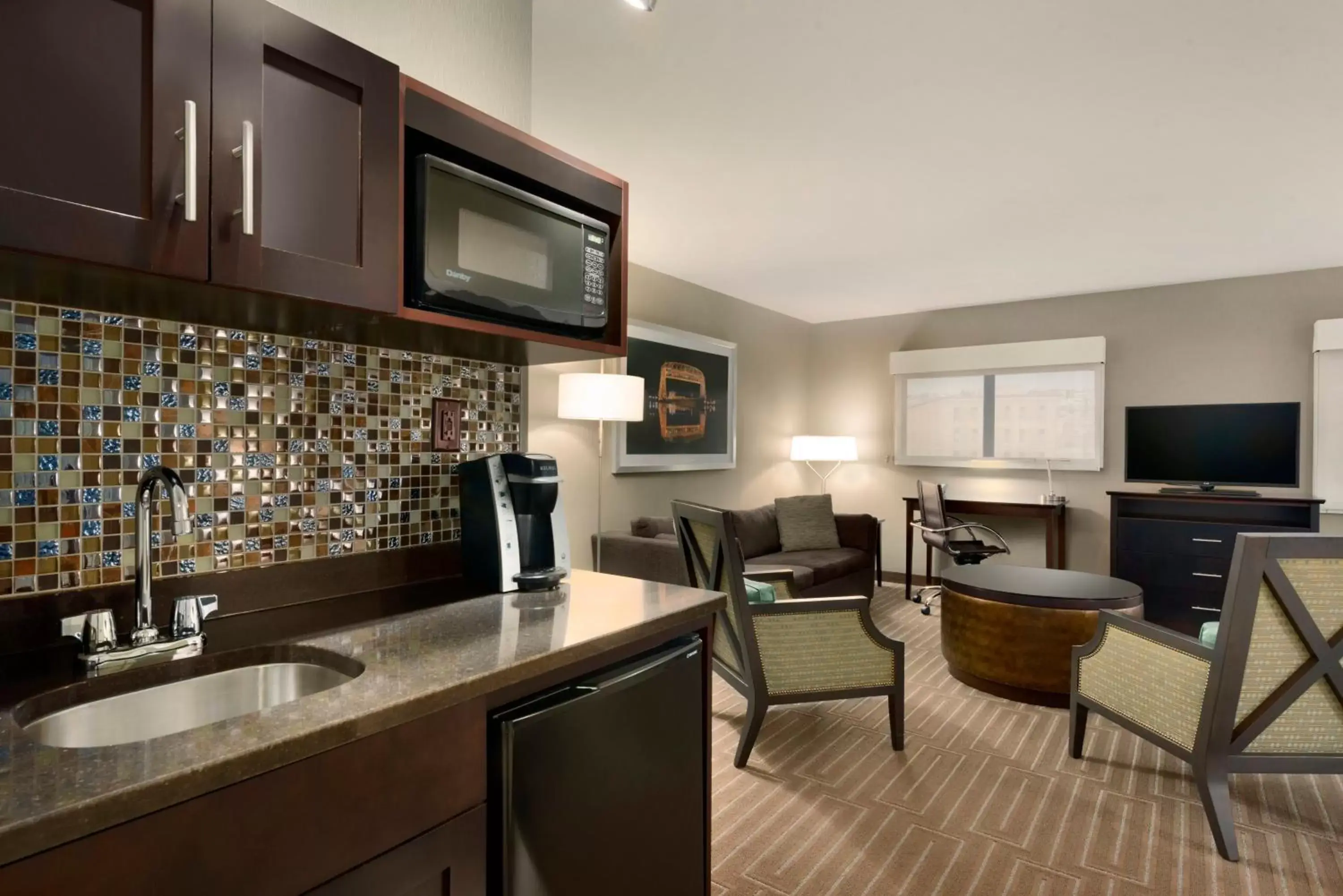 Bedroom, Kitchen/Kitchenette in Holiday Inn & Suites Duluth-Downtown, an IHG Hotel