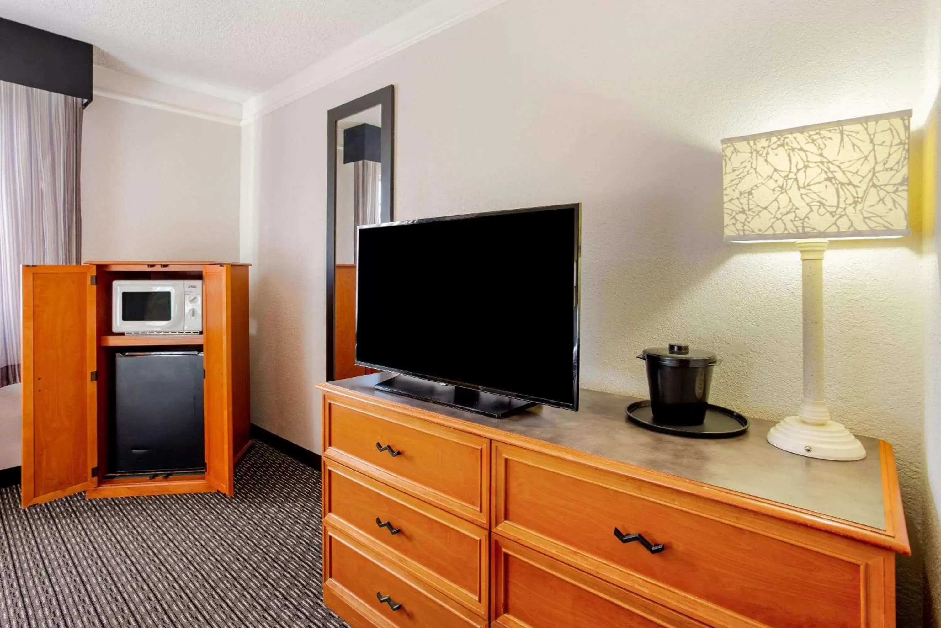 Photo of the whole room, TV/Entertainment Center in La Quinta Inn by Wyndham Champaign