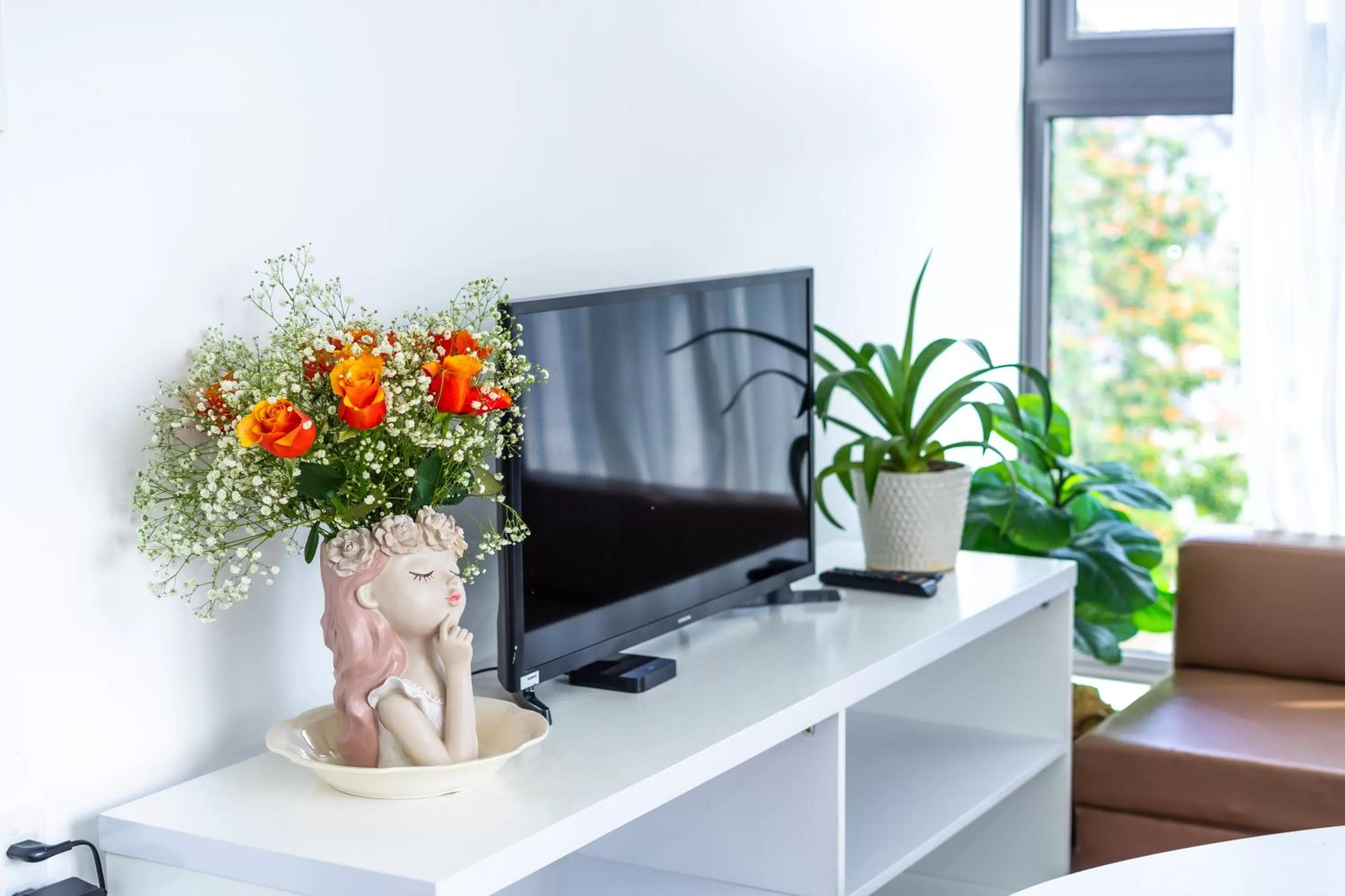 Communal lounge/ TV room in Ngàn Phố Studio & Love Hotel