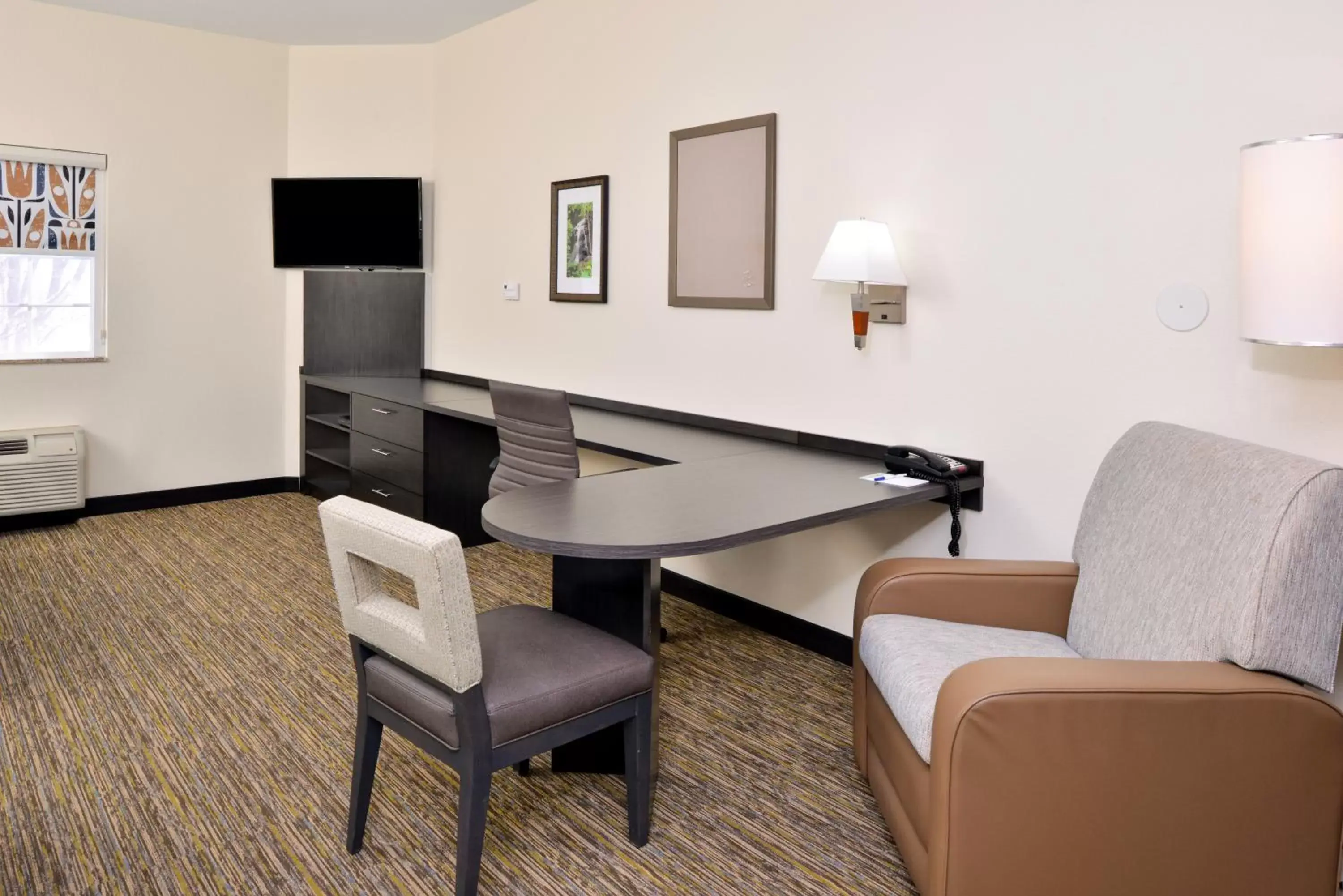 Photo of the whole room, Seating Area in Candlewood Suites Winchester, an IHG Hotel