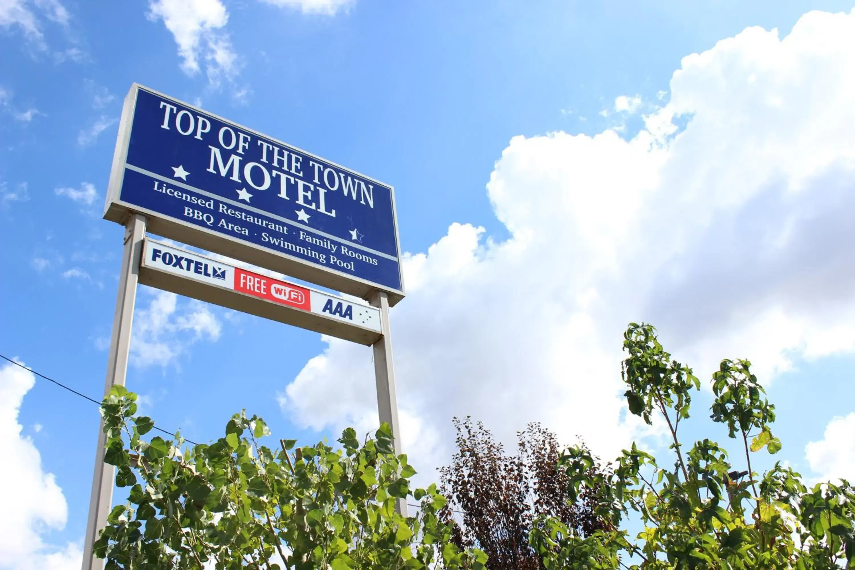 Property logo or sign in Top of the Town Motel