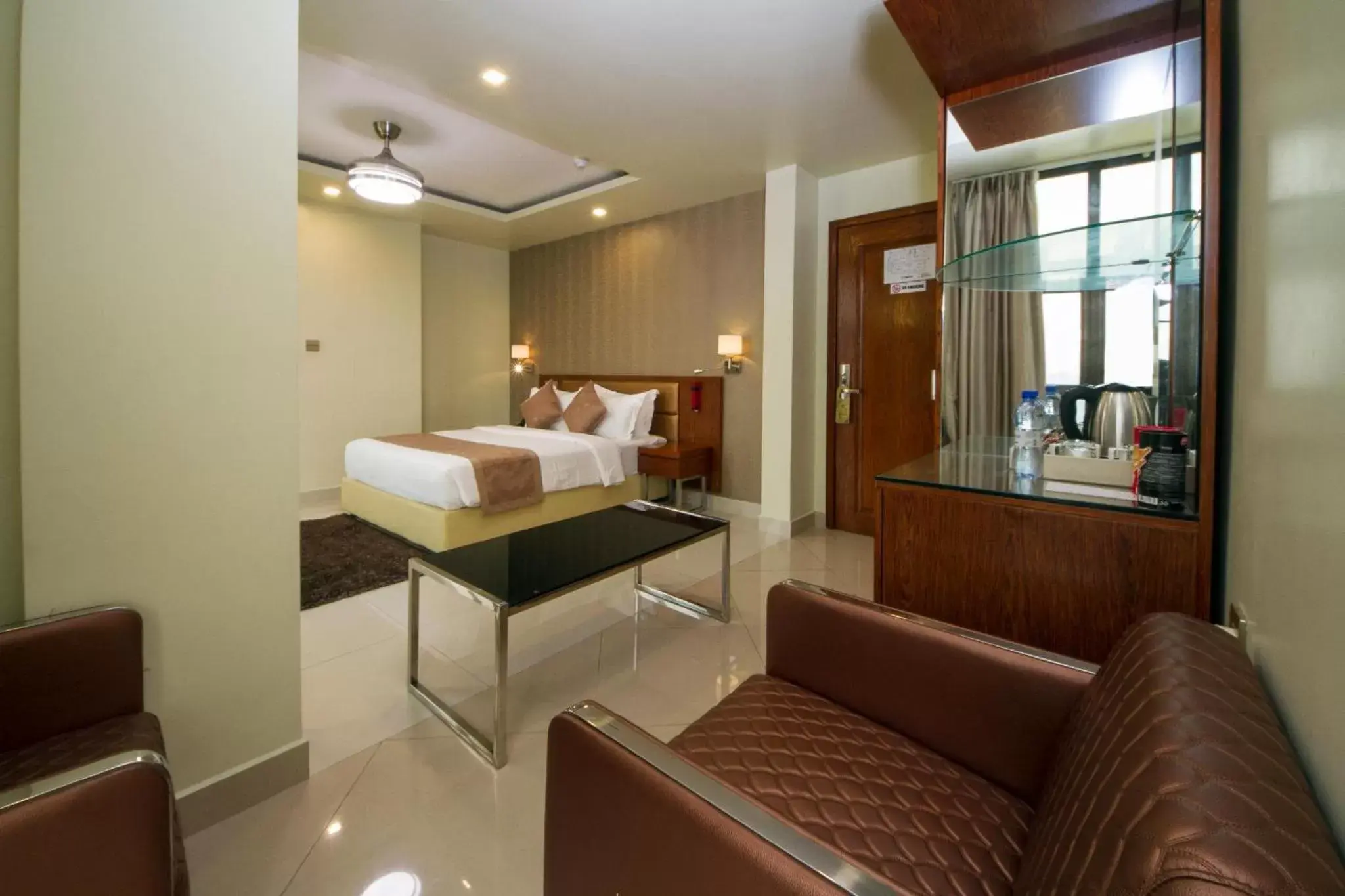 Photo of the whole room, Bed in Unima Grand