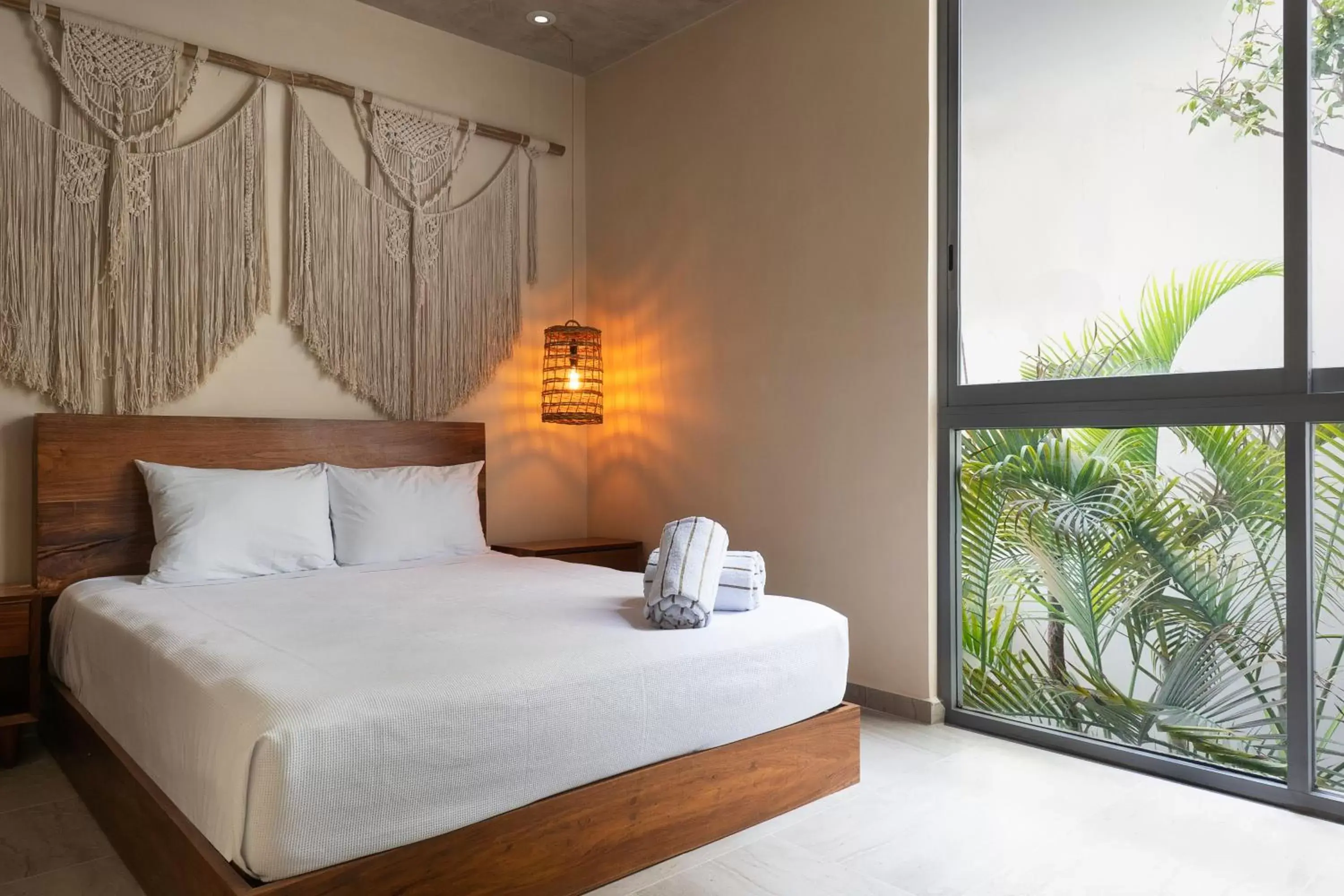 Bed in ARUNA TULUM-Luxury Studios & Apartments