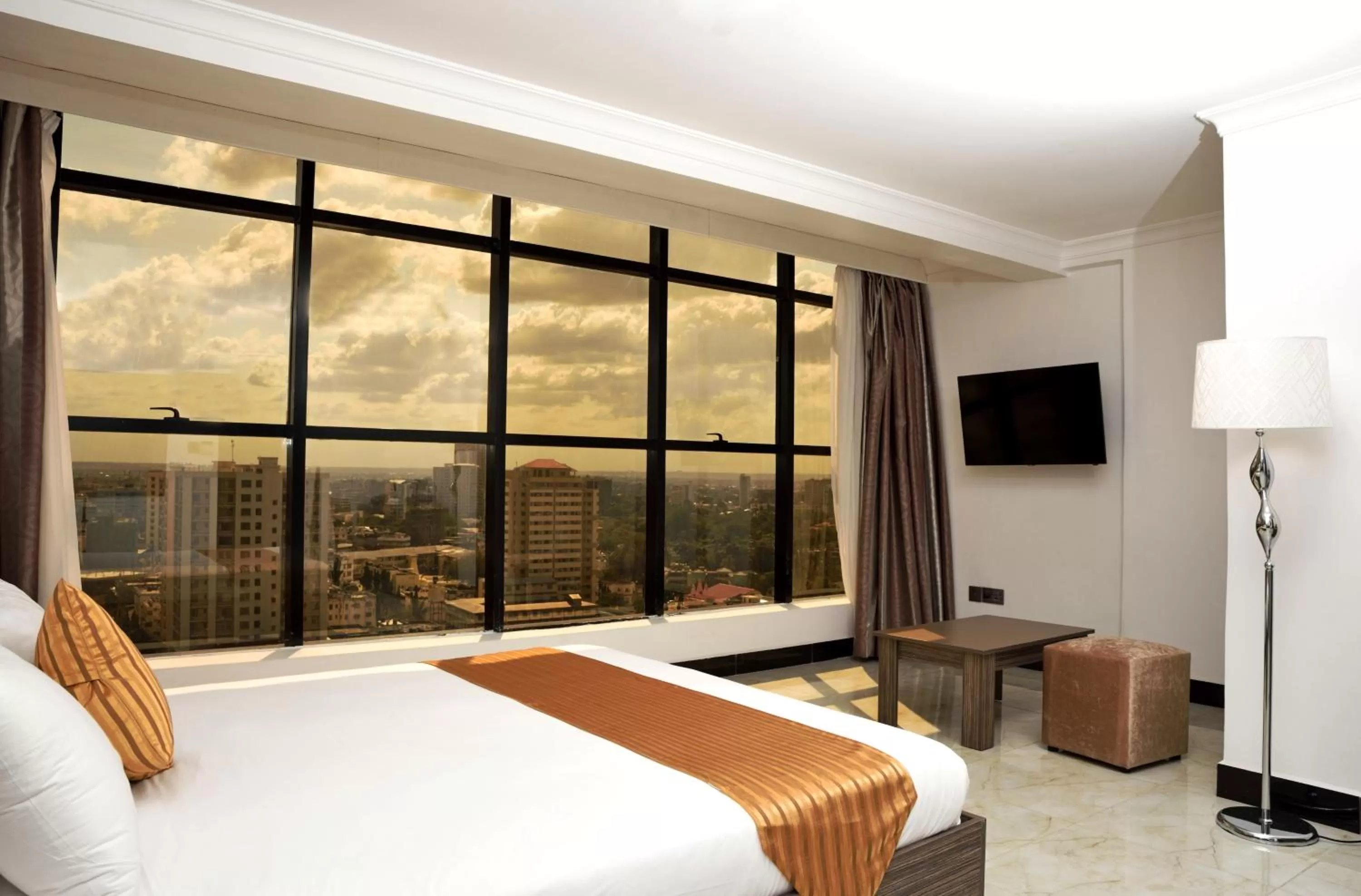 Photo of the whole room, Bed in Golden Tulip Dar Es Salaam City Center Hotel
