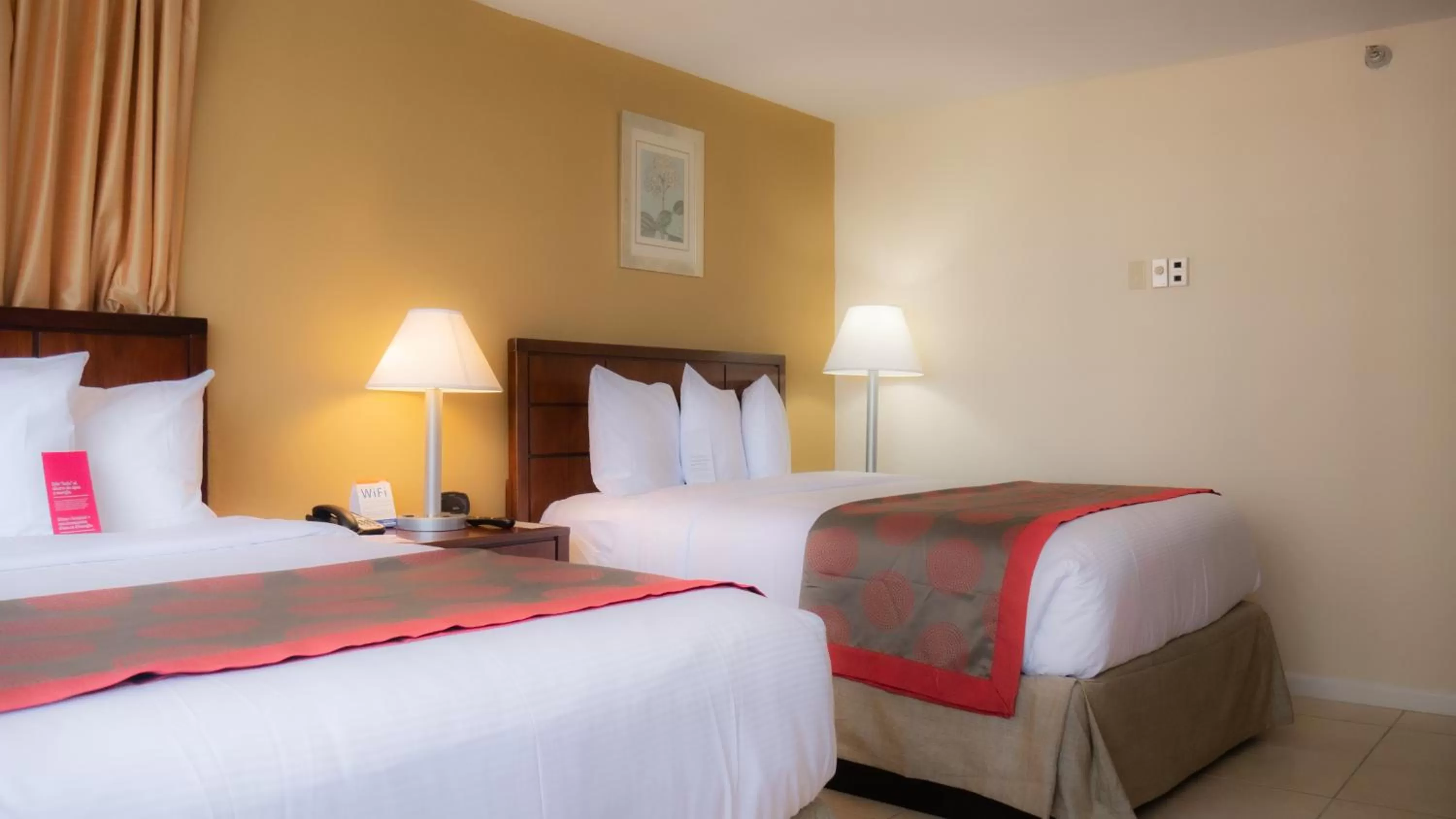 Bed in Ramada Plaza by Wyndham Marco Polo Beach Resort