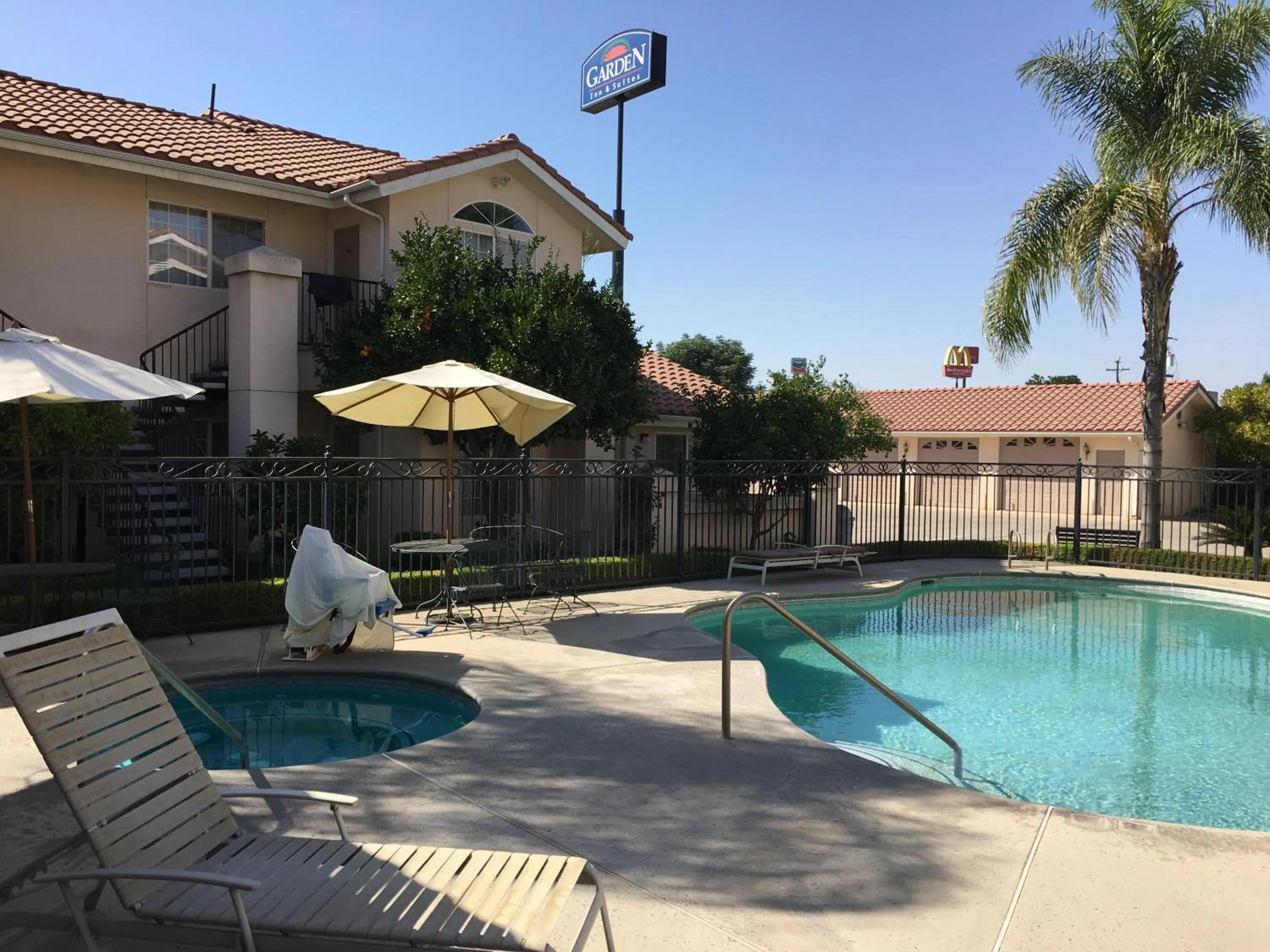 Property logo or sign in Garden Inn and Suites Fresno