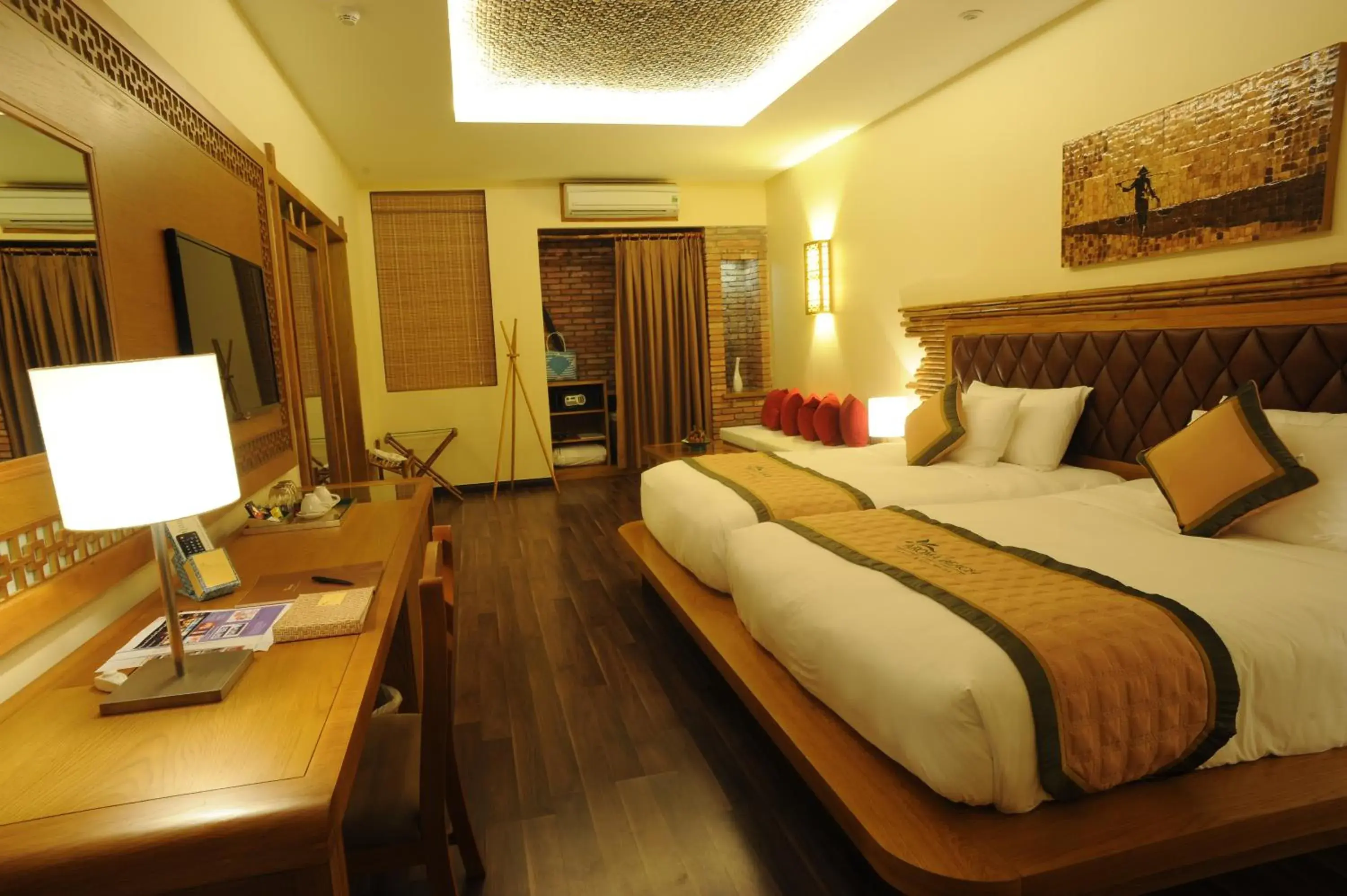 Bed in Aroma Beach Resort and Spa