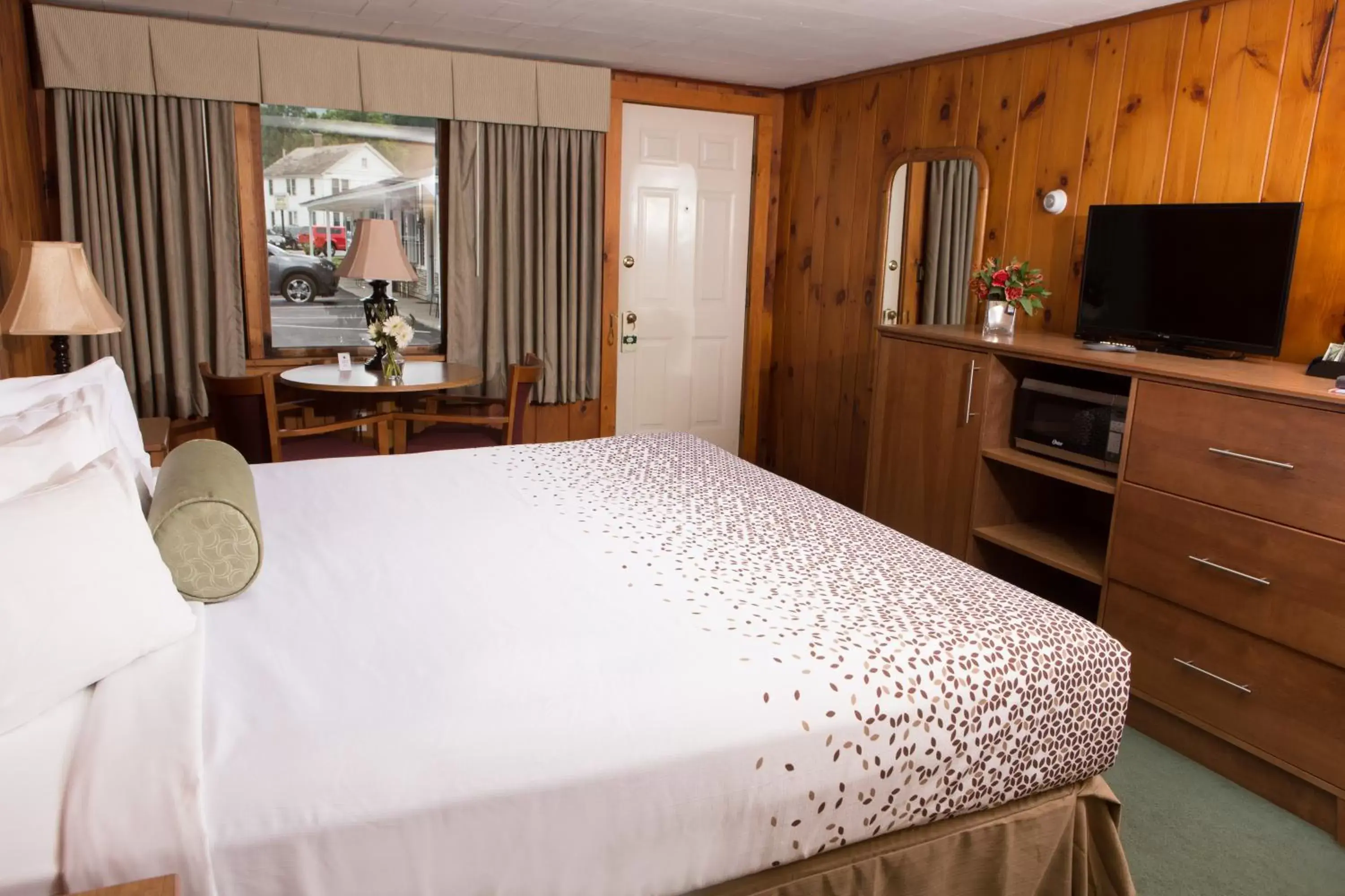 Bed in Knotty Pine Motel